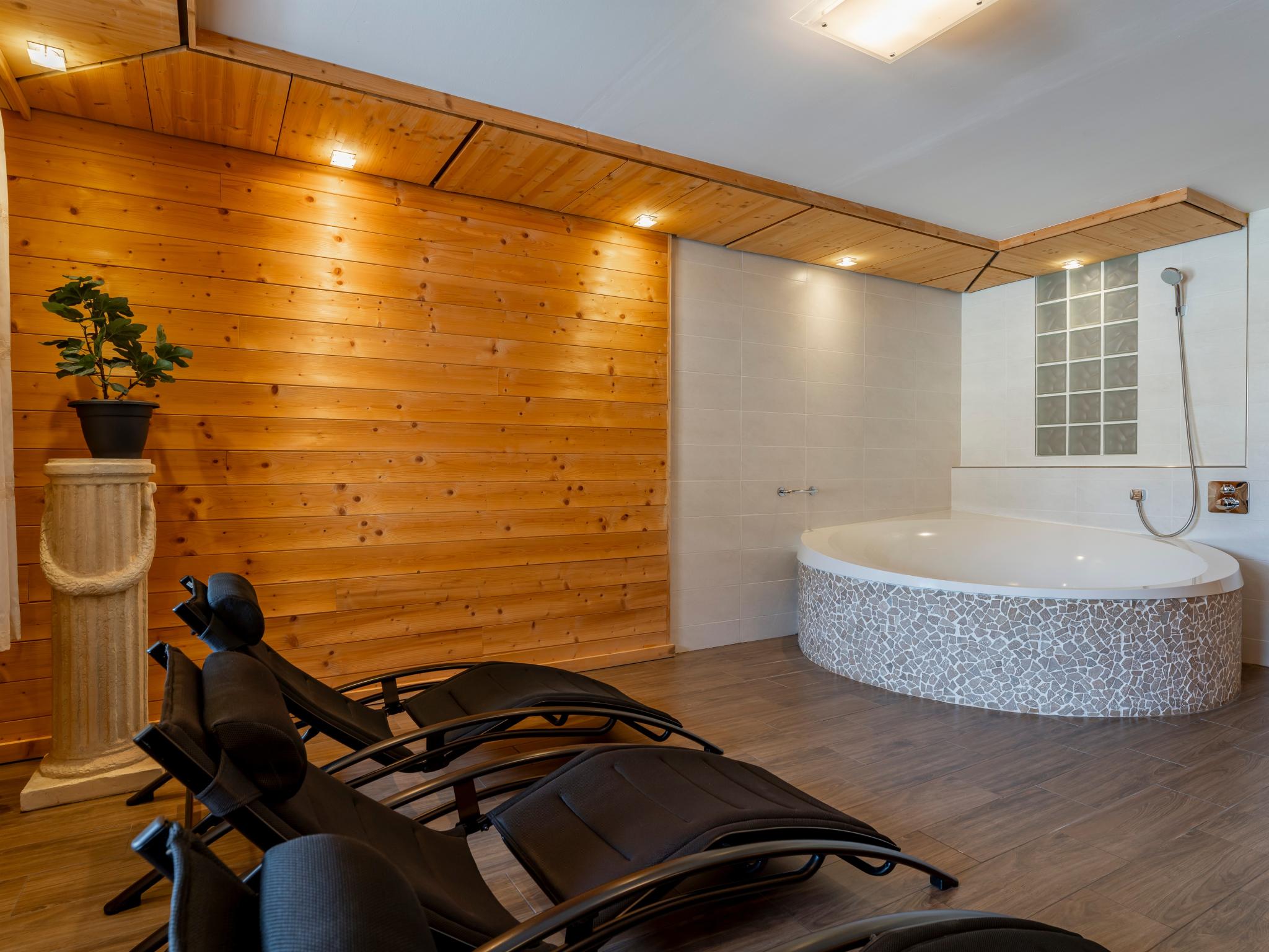 Bedroom with comfortable beds at Chalet Kristall II in Grossarl