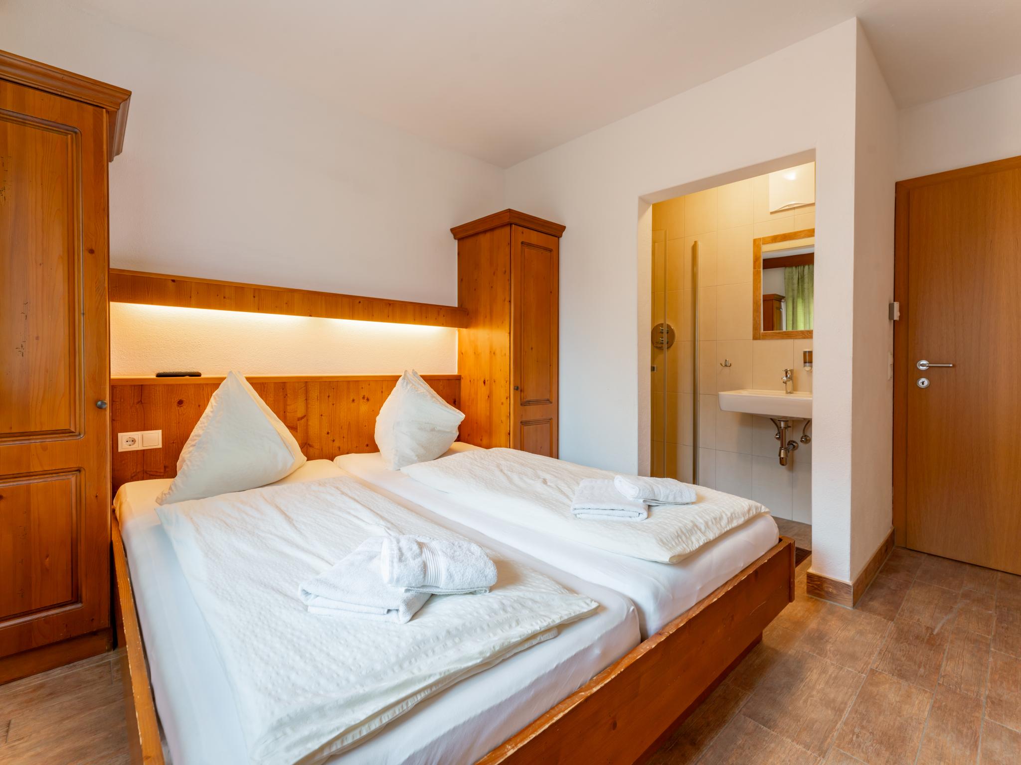 Bedroom with comfortable beds at Chalet Vorderjausern in Saalbach-Hinterglemm