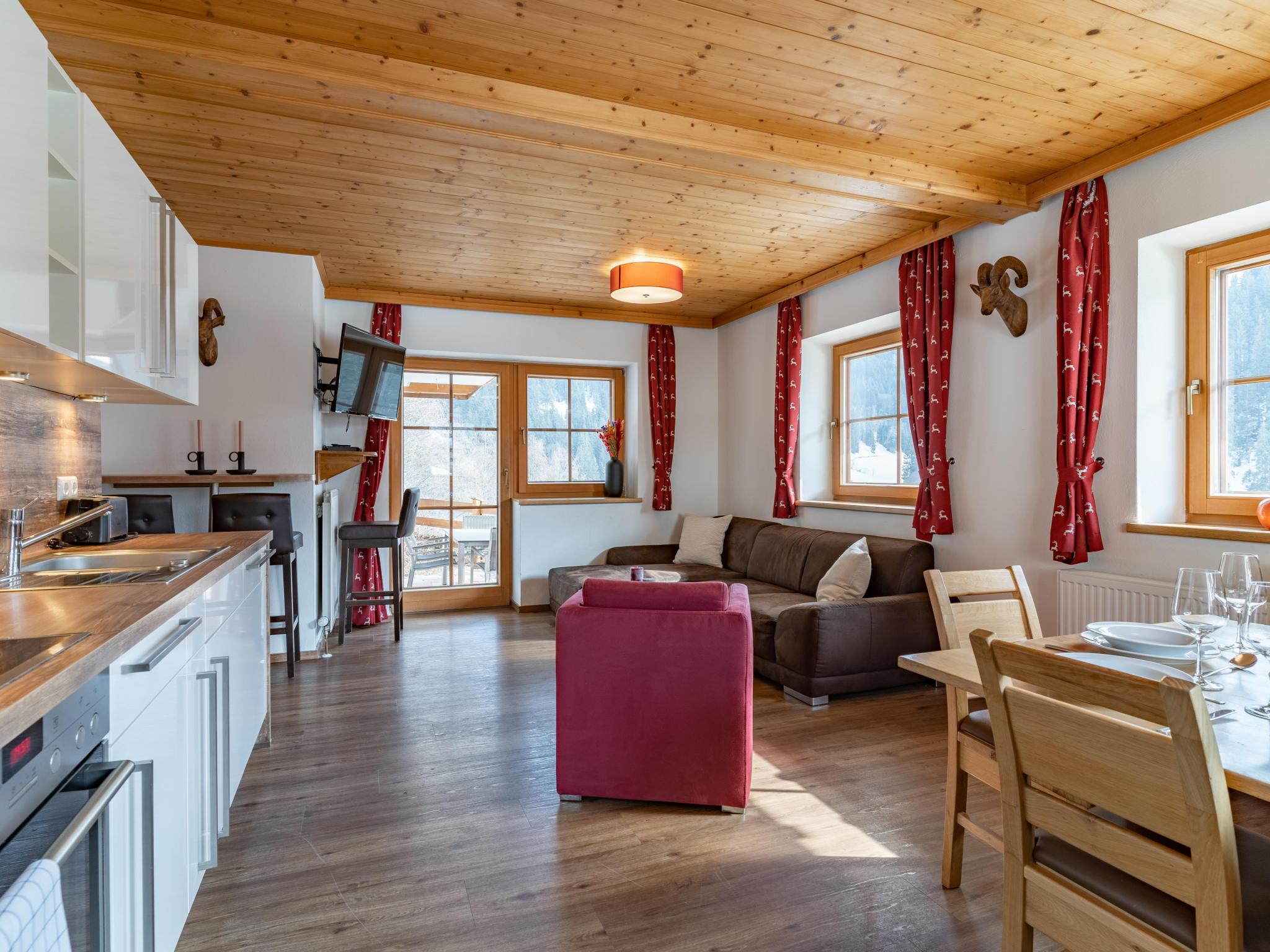 Bedroom with comfortable beds at Alpensteinbock Saalbach B in Saalbach-Hinterglemm