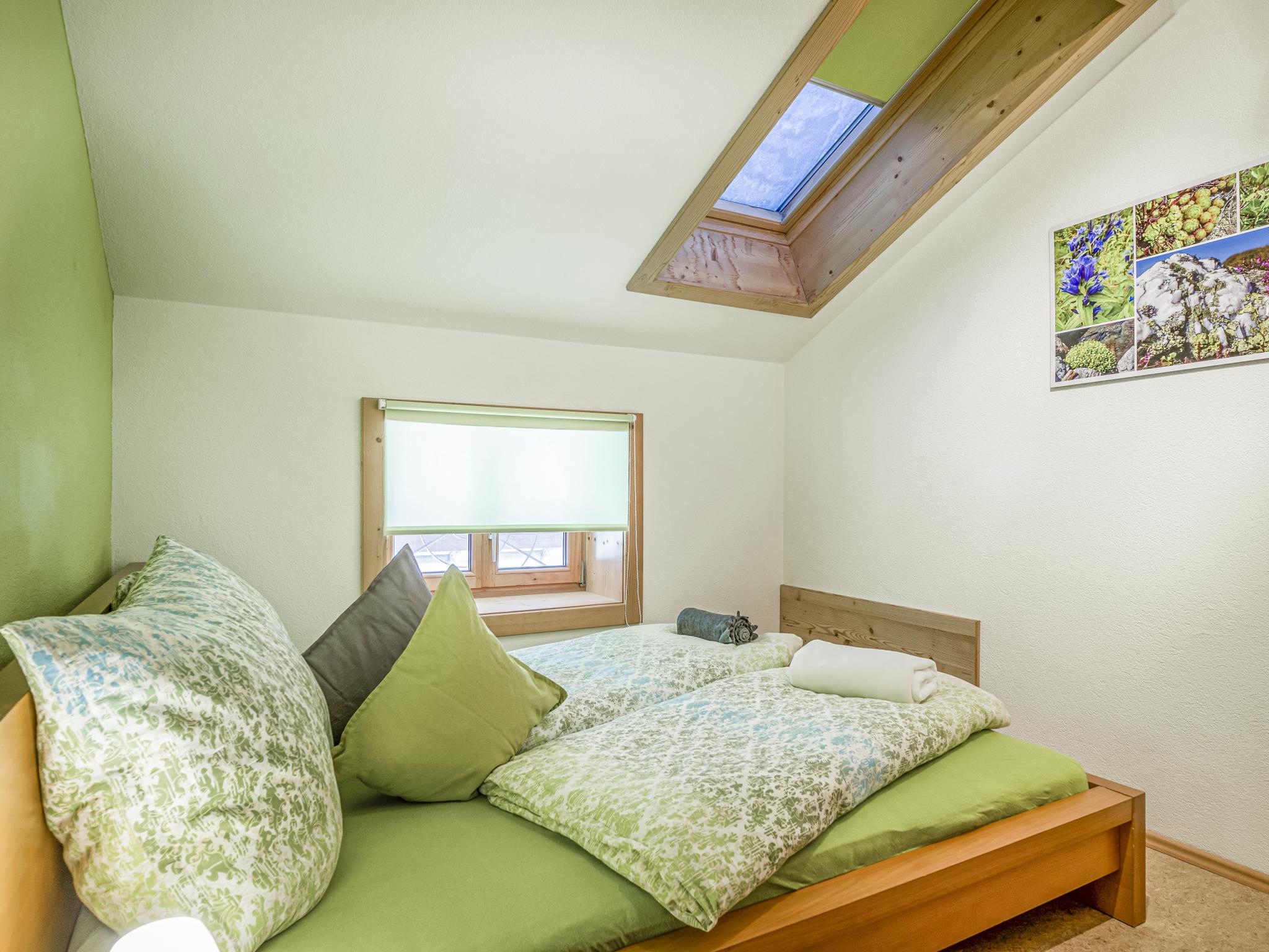 Bedroom with comfortable beds at Troadstadl Brixentalblick in Westendorf