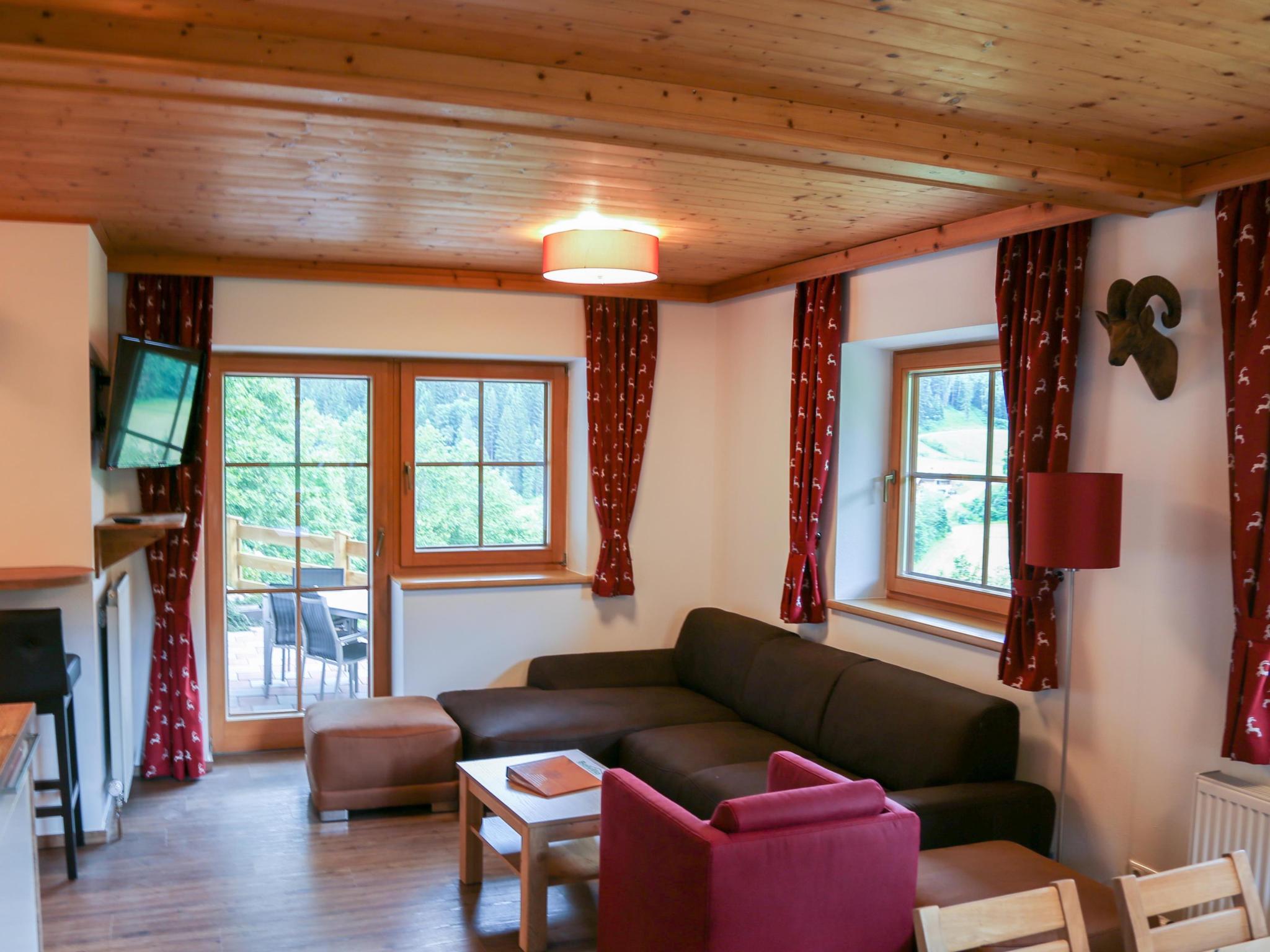 Bedroom with comfortable beds at Alpensteinbock Saalbach L in Saalbach-Hinterglemm