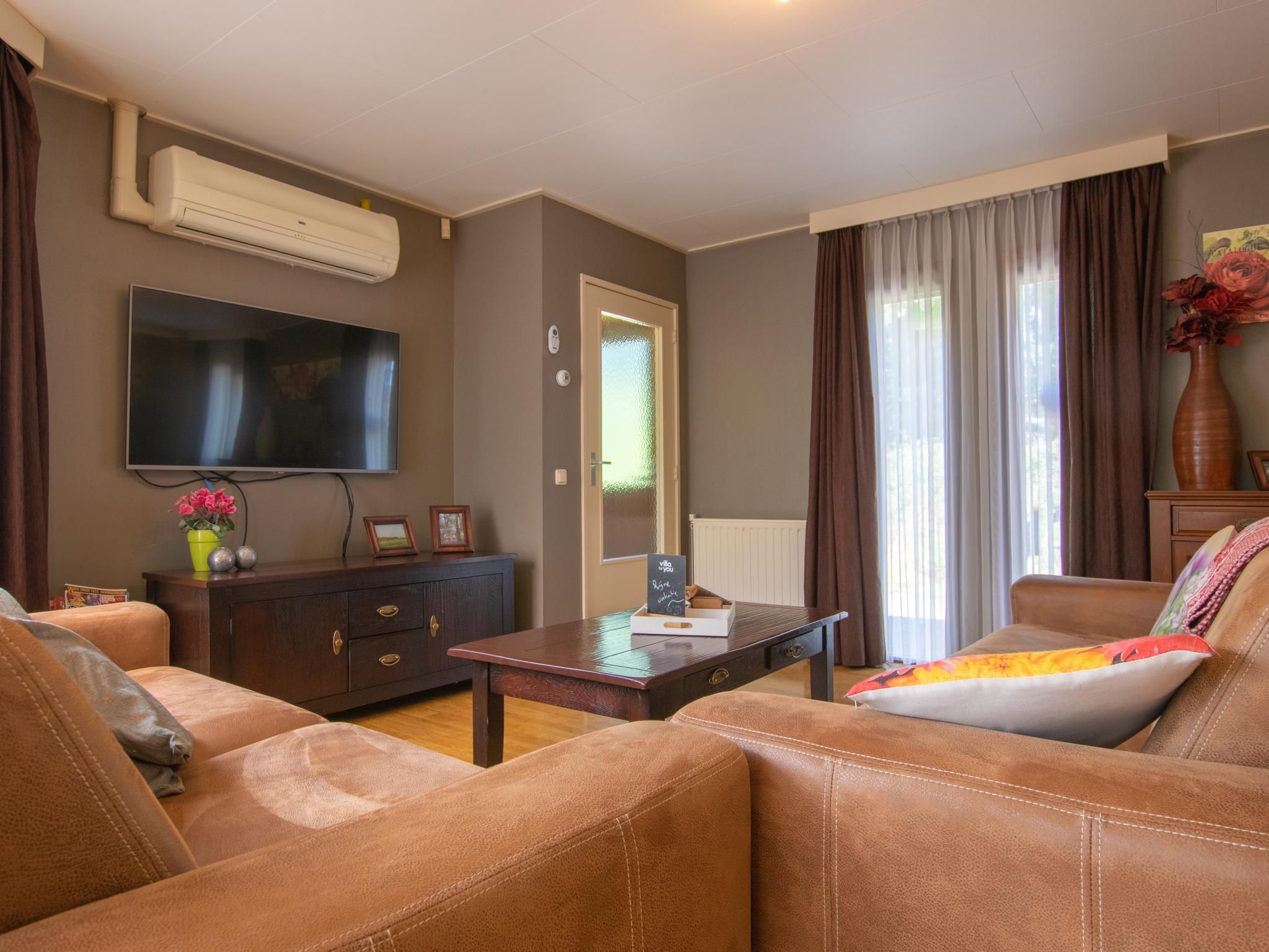 Outdoor terrace and views at Villa Maashorst in Uden