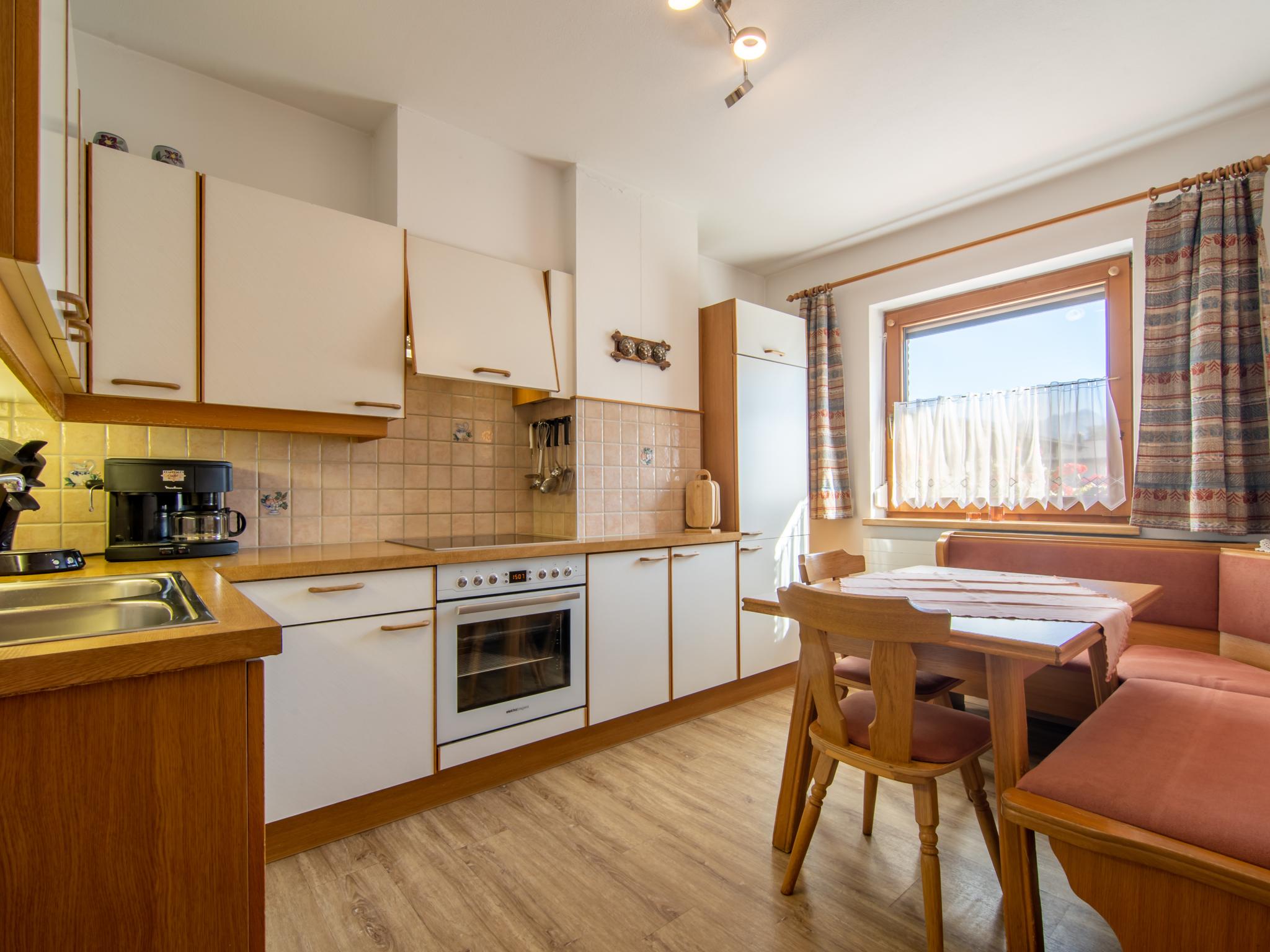 Bedroom with comfortable beds at Ferienwohnung Horvath in Uderns