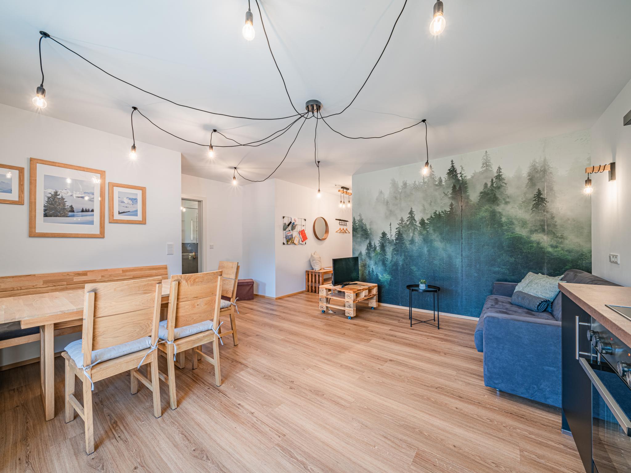 Bedroom with comfortable beds at Tirola Bude in Hopfgarten im Brixental