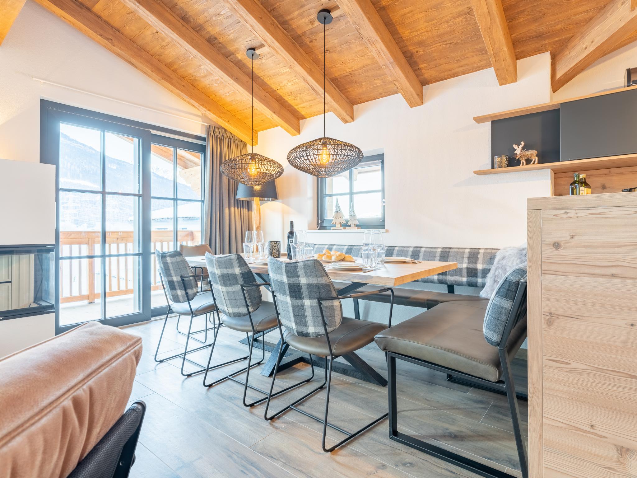 Bedroom with comfortable beds at Tauernlodge Chalet Salzach in Niedernsill