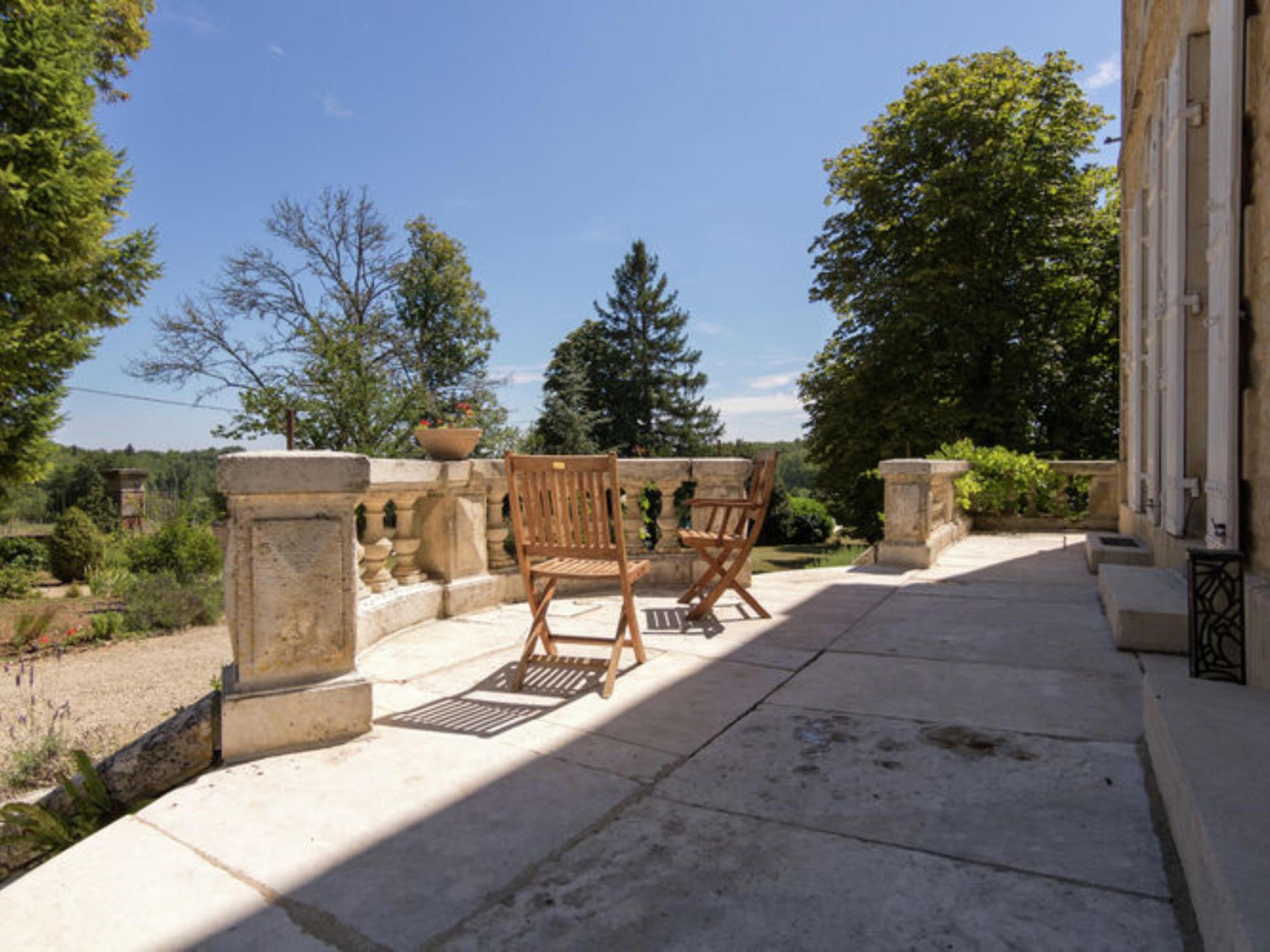 Bedroom with comfortable beds at Le Petit Chateau in Brouchaud