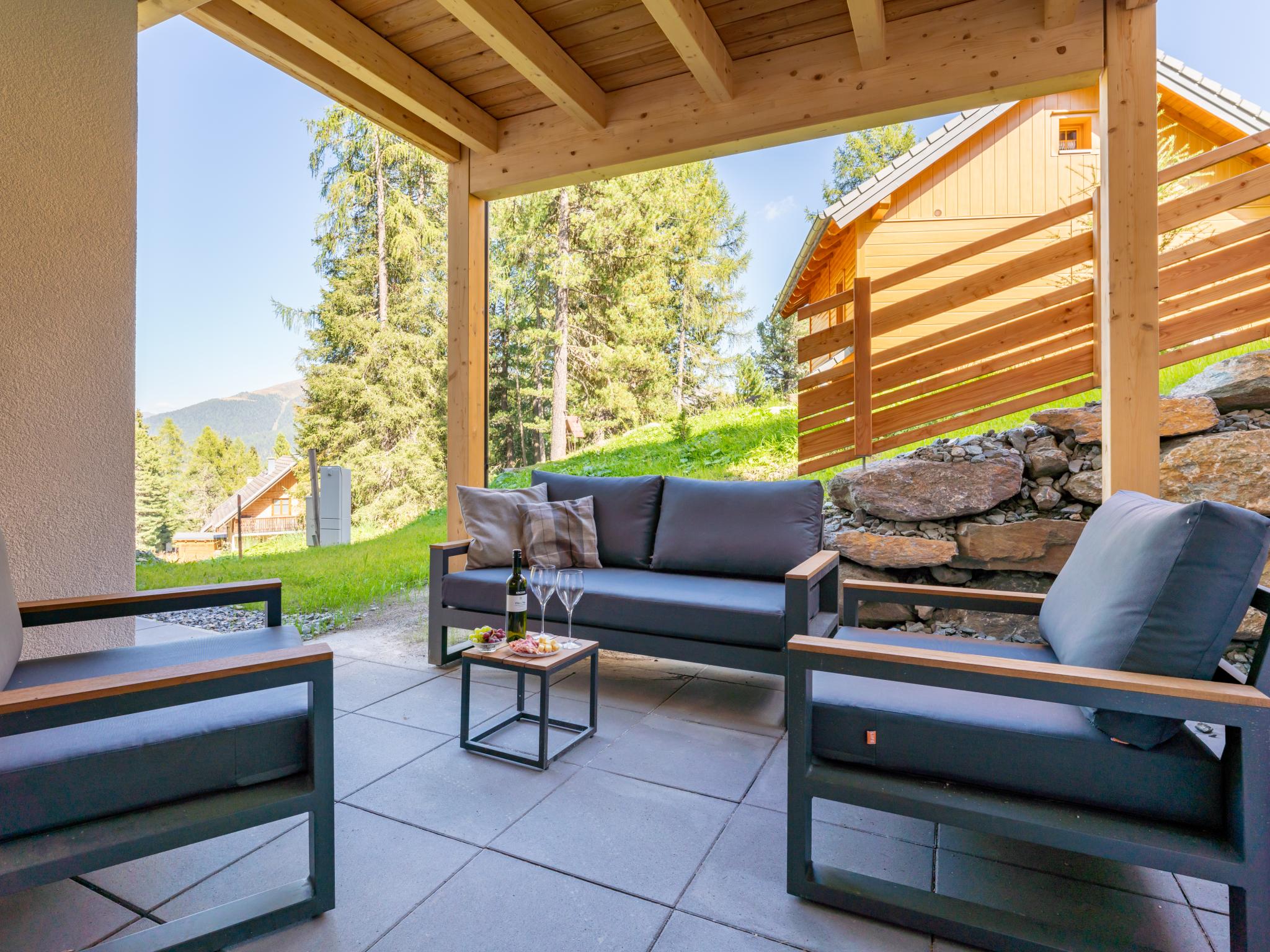 Bedroom with comfortable beds at Romantik Mountain Chalet in Turracher Höhe