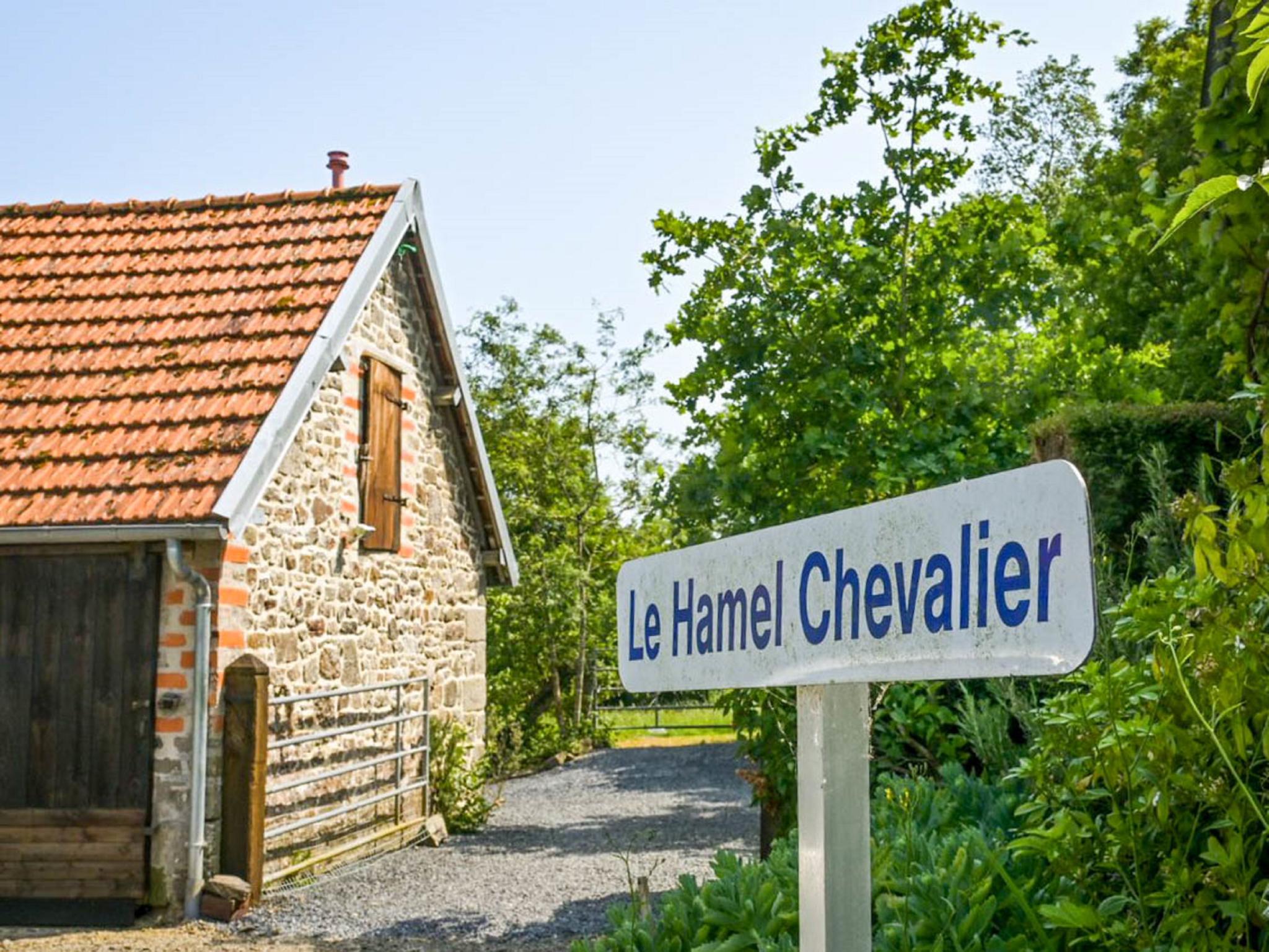 Bedroom with comfortable beds at Gite Le Chevalier in Gavray