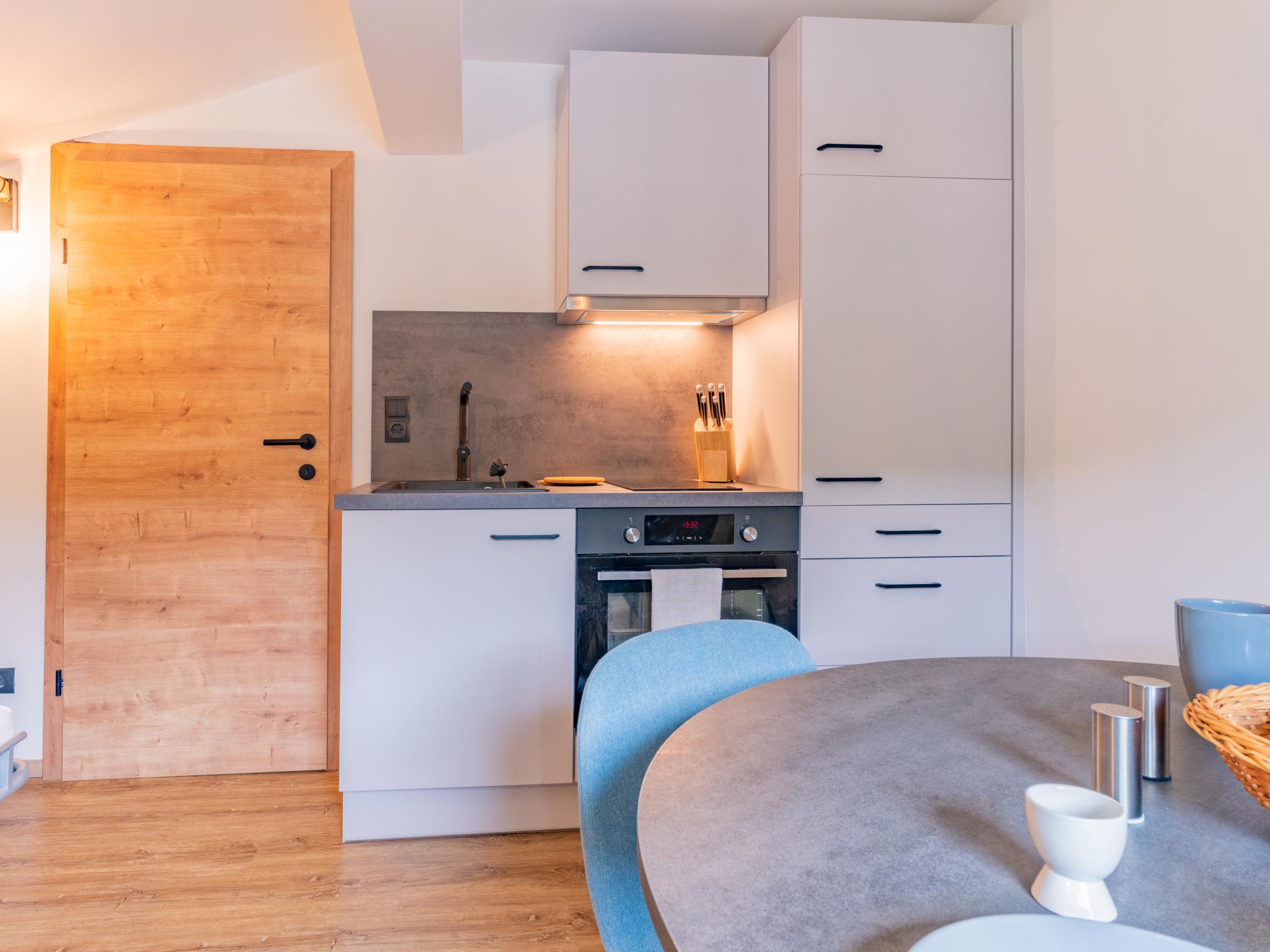 Bedroom with comfortable beds at Tirola Stadl Vroni in Hopfgarten im Brixental