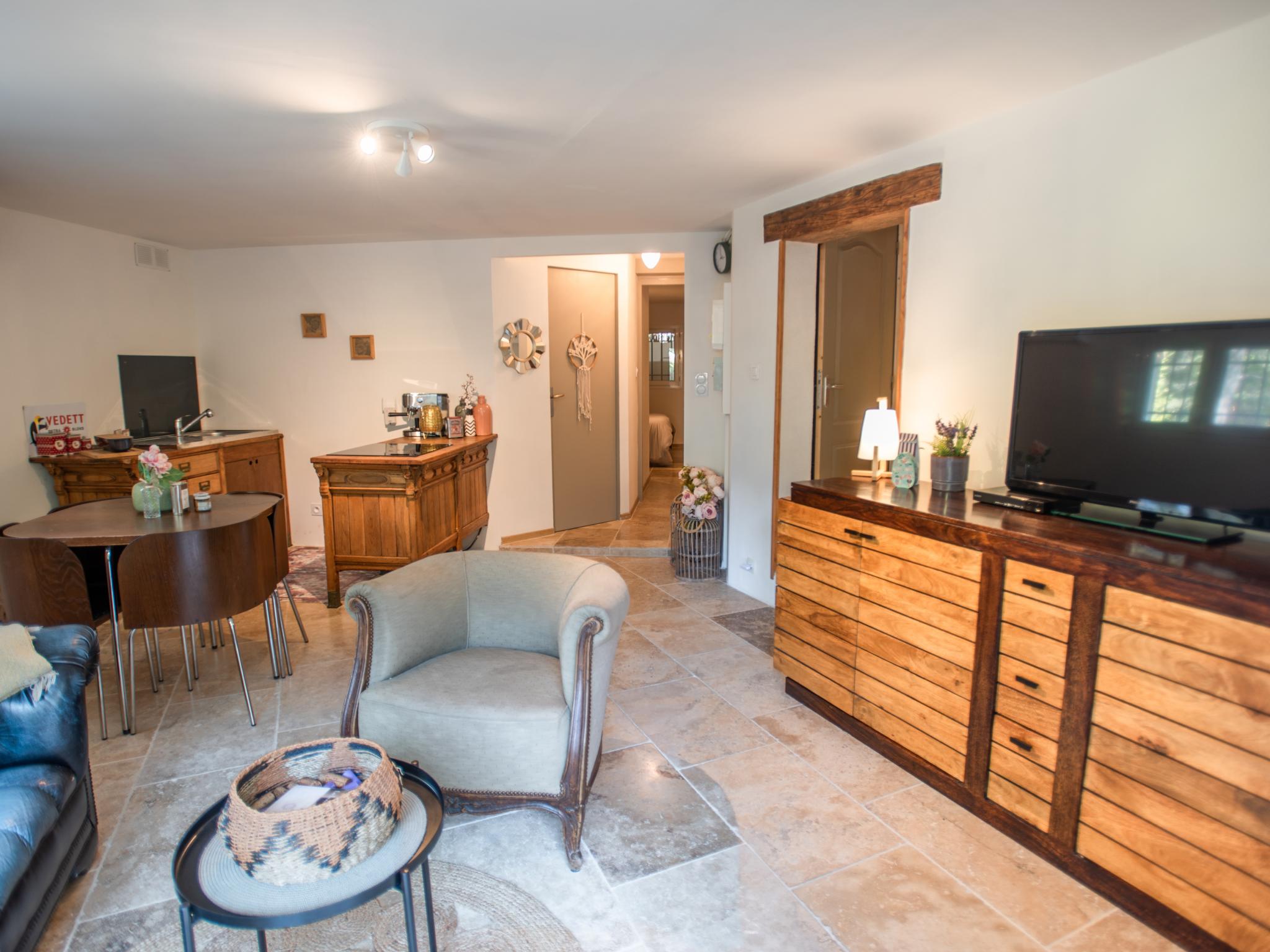 Swimming pool area at La grande Pinède in Faucon