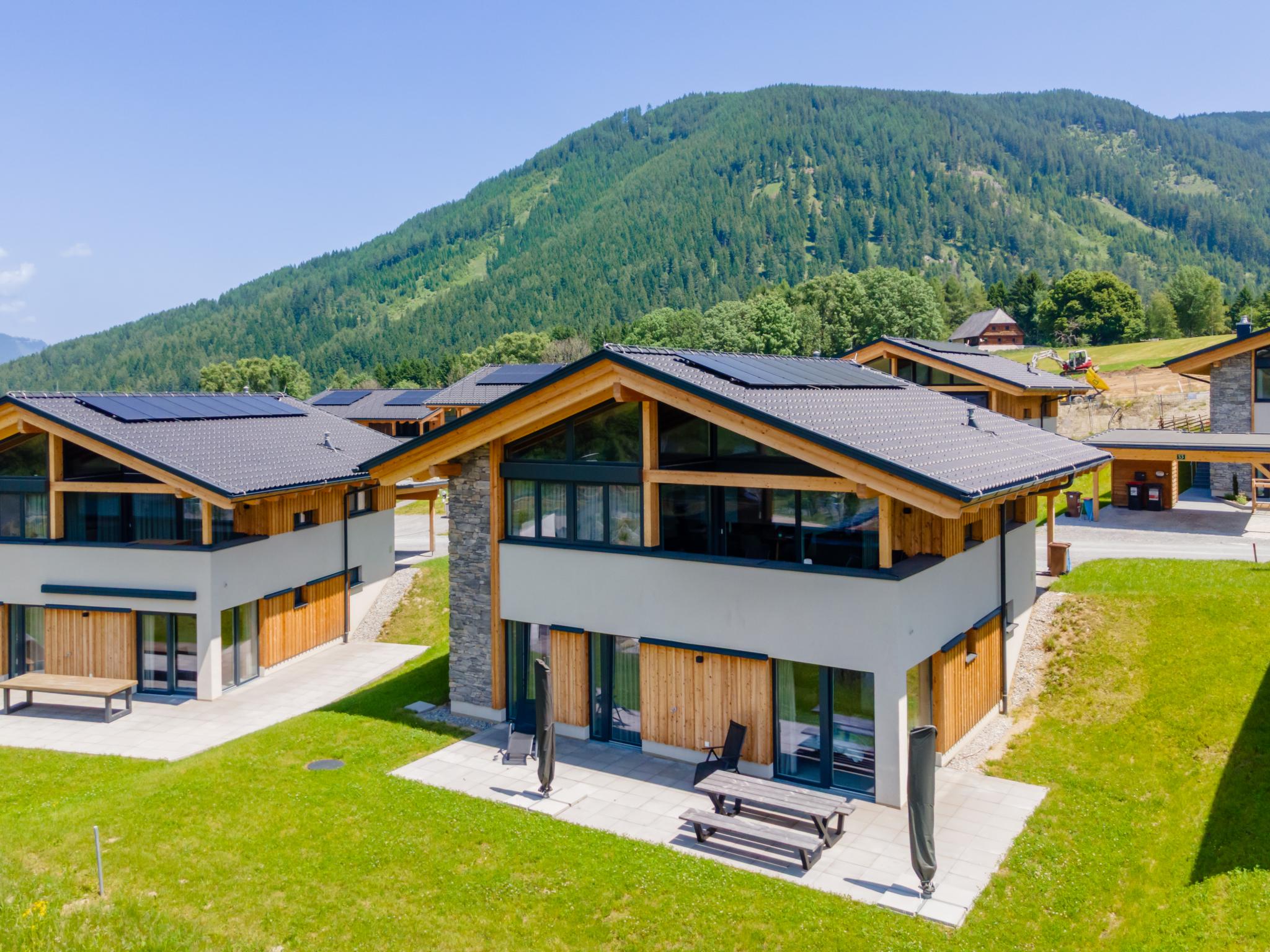 Bedroom with comfortable beds at Grebenzen Top Chalet Mazzel in Sankt Lambrecht