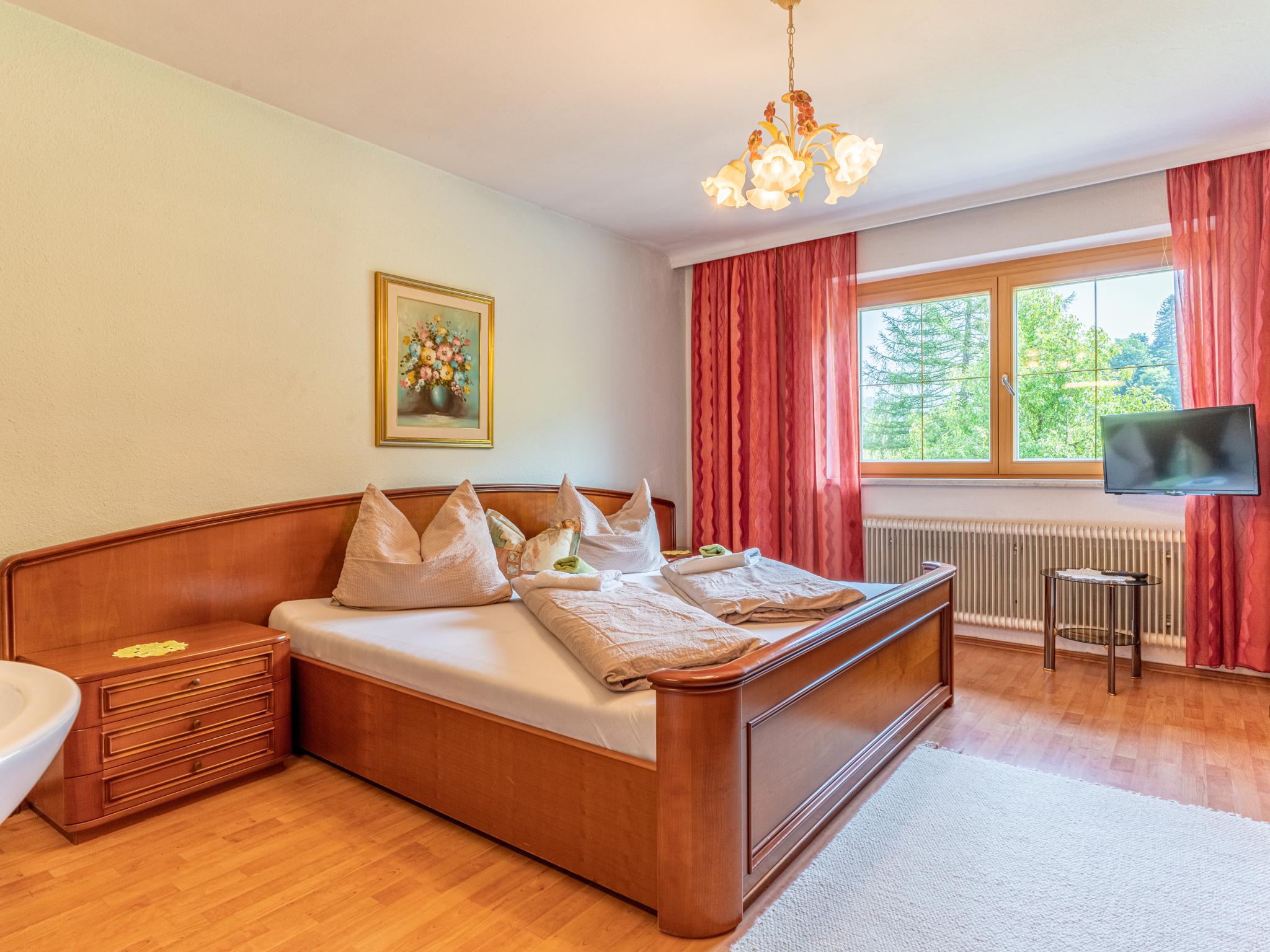 Bedroom with comfortable beds at Hintermühltalhof in Itter