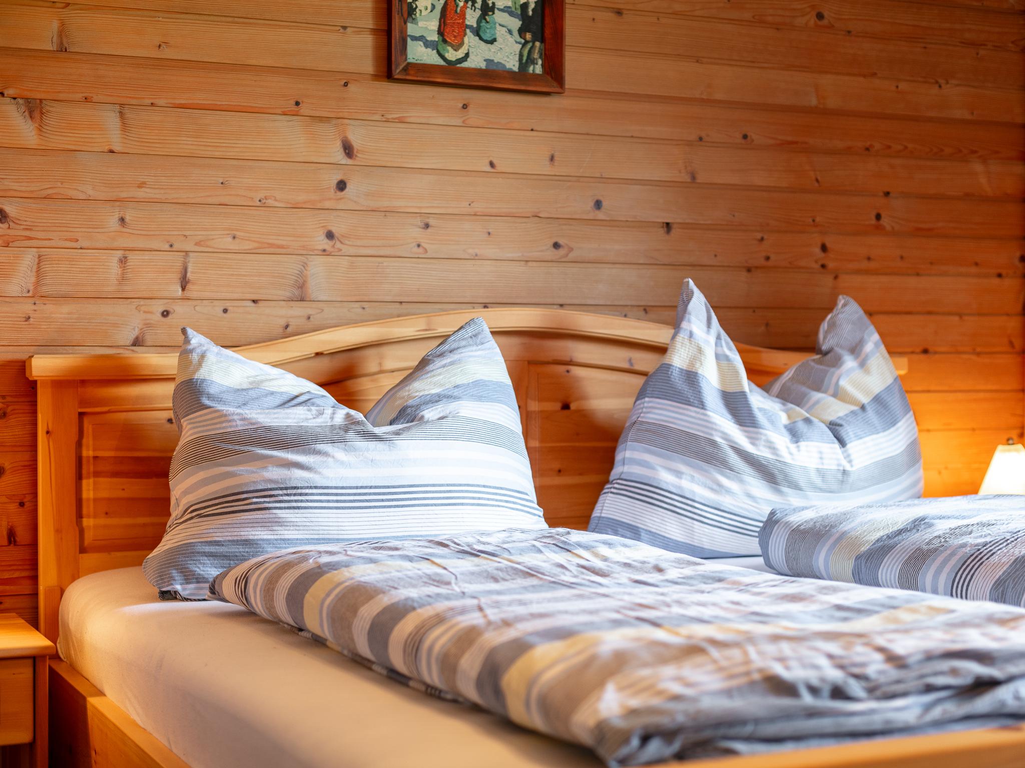 Bedroom with comfortable beds at Haus Alpenblick in Hopfgarten im Brixental