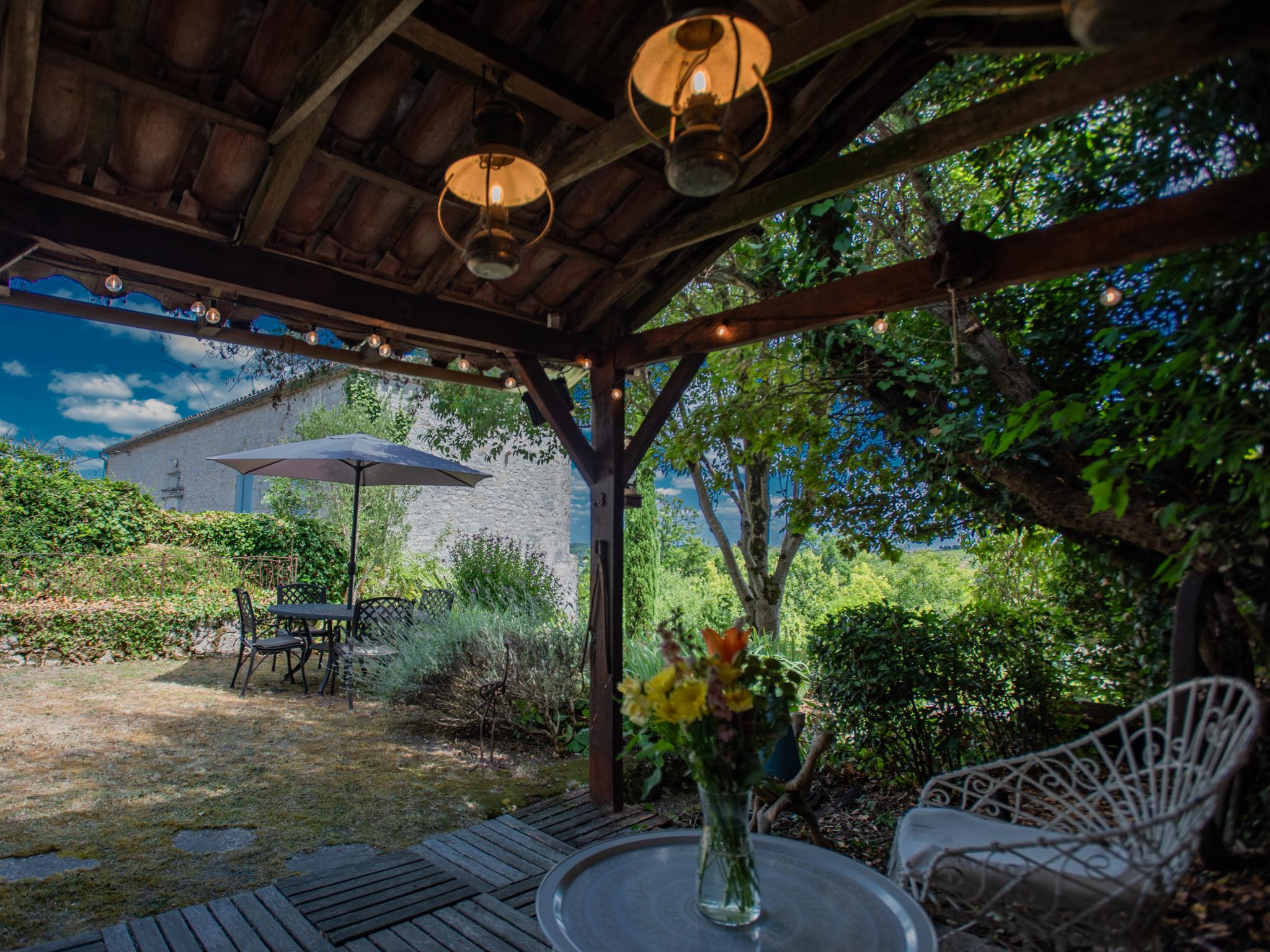 Swimming pool area at Les Roches de Roquecor in roquecor