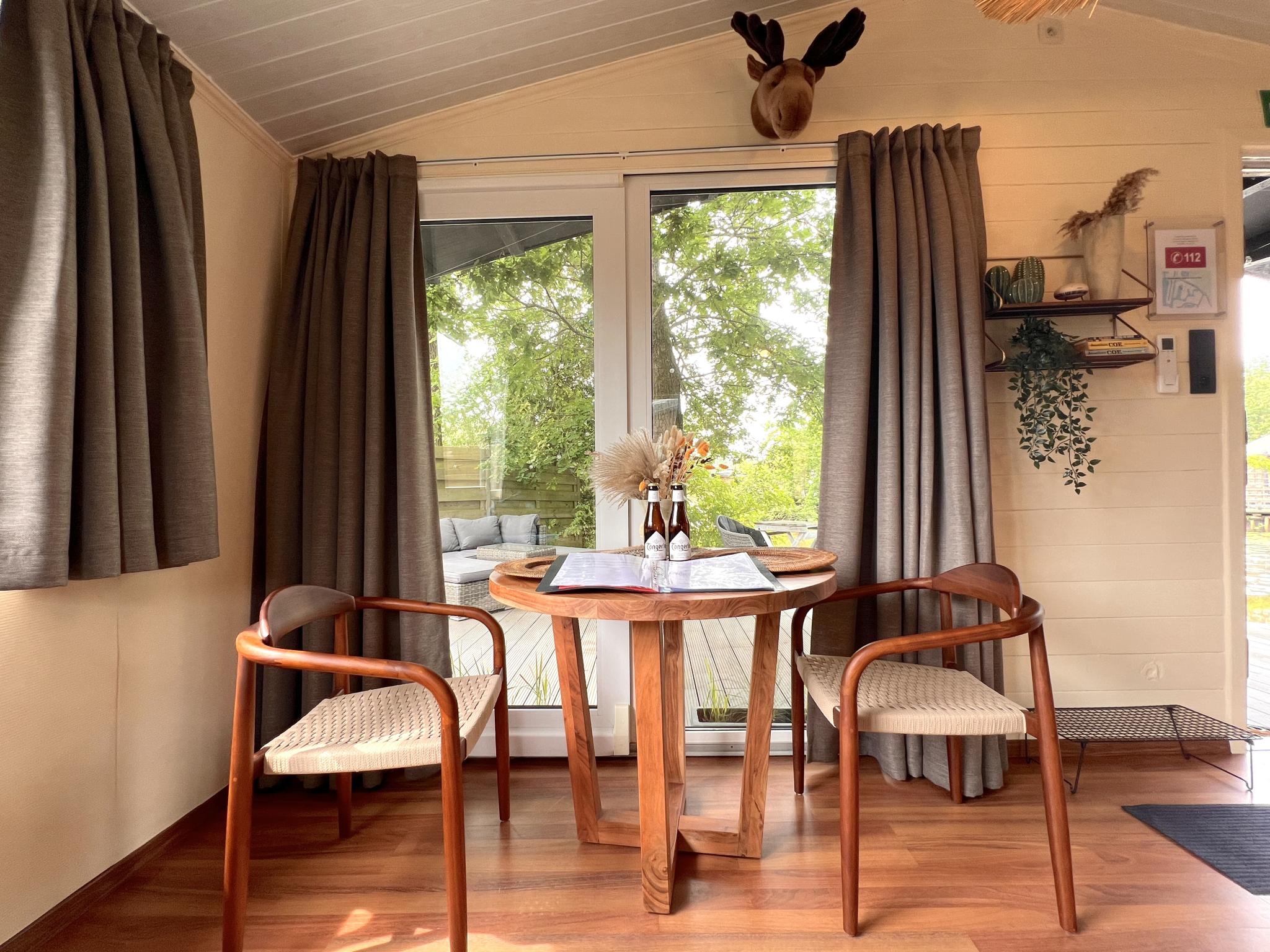 Bedroom with comfortable beds at Charlies Chalet in Geel