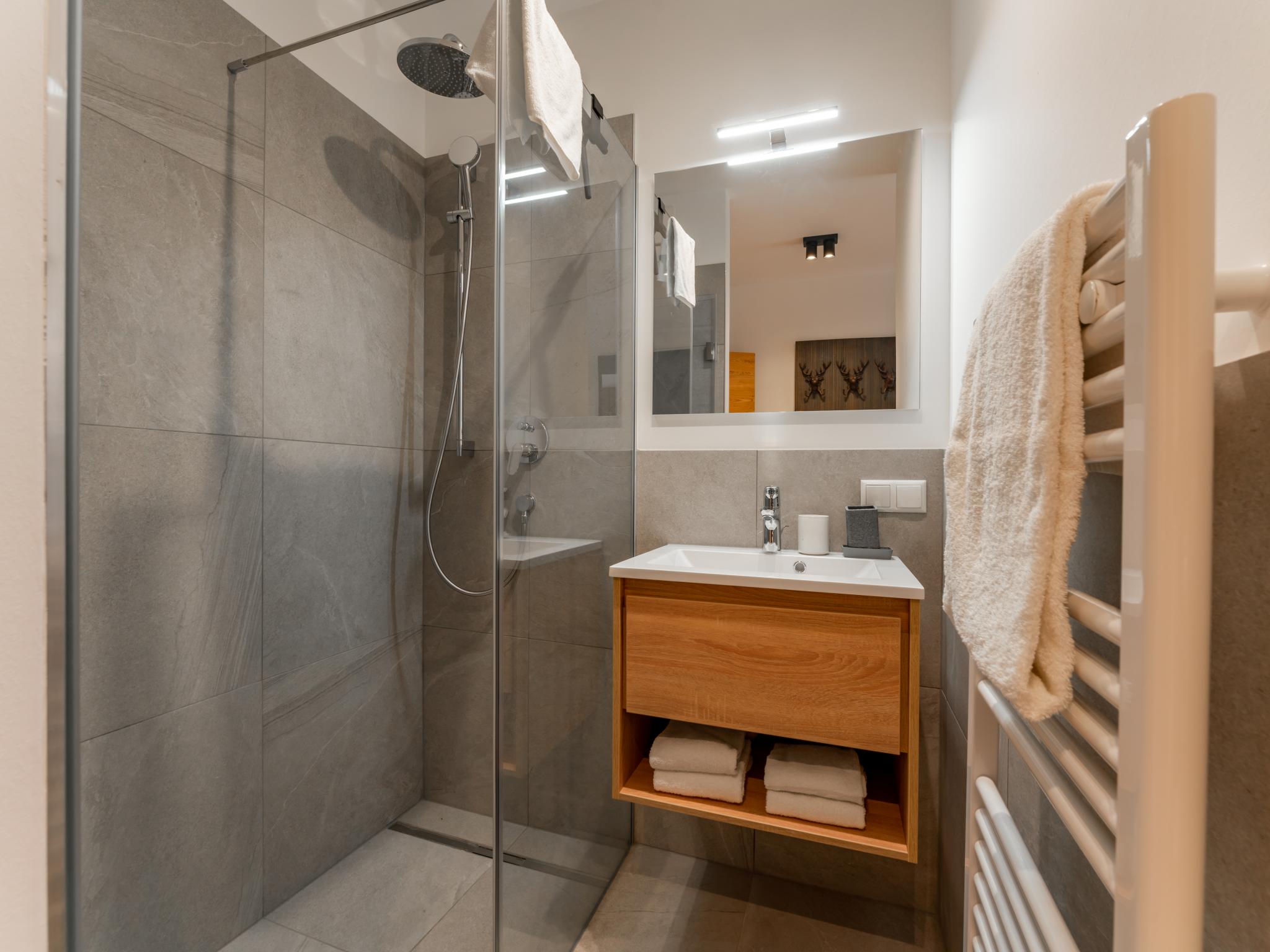 Swimming pool area at Grebenzen Lodge Edelblick in Sankt Lambrecht