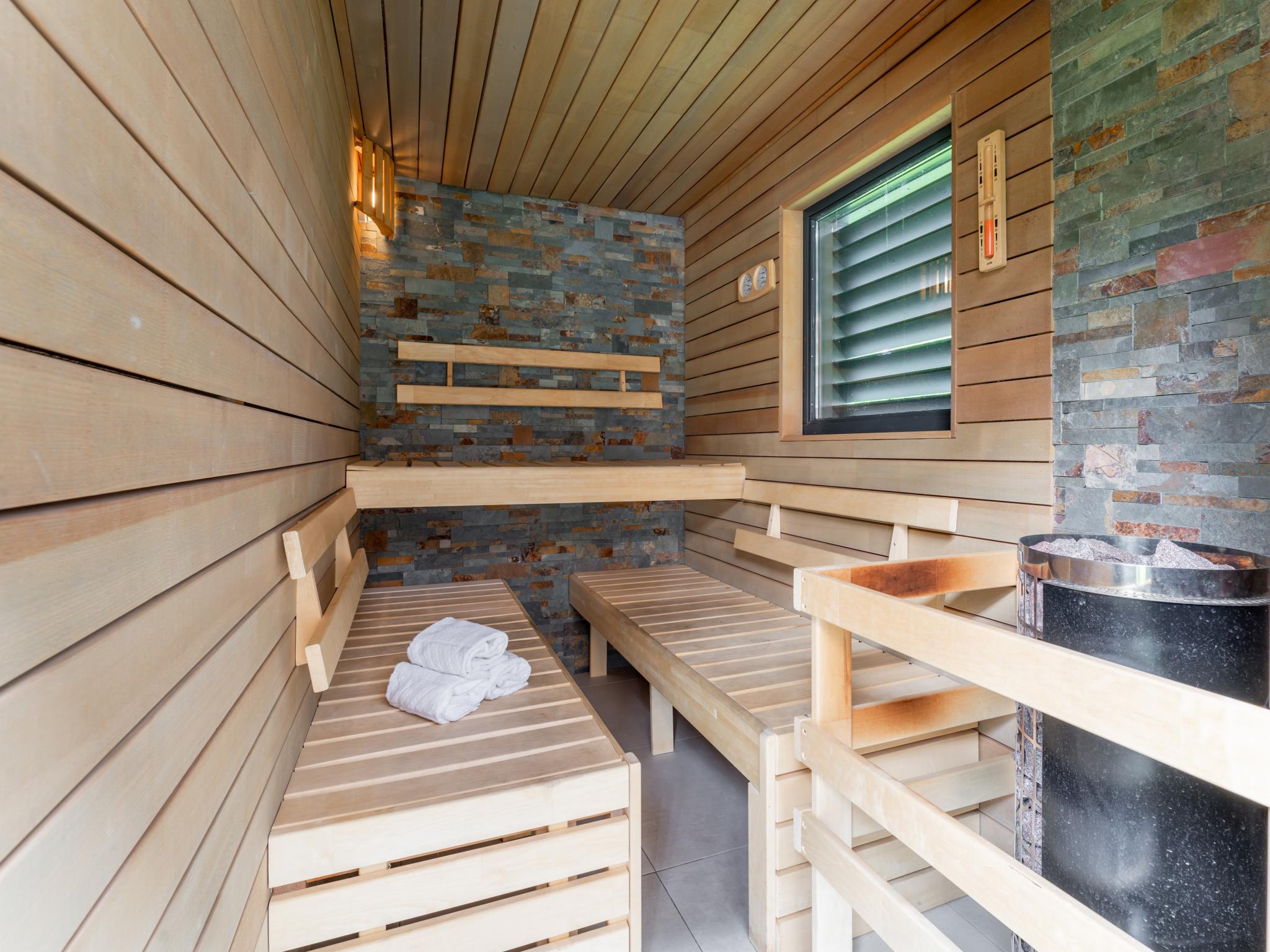 Bedroom with comfortable beds at Alpinn Wellness 2 in Sankt Margarethen im Lungau