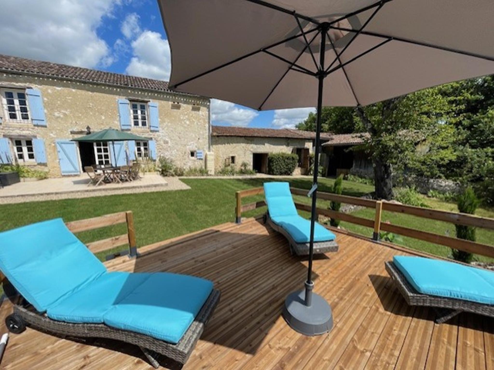 Outdoor terrace and views at Gite le Nourrissat in Savignac-de-Duras