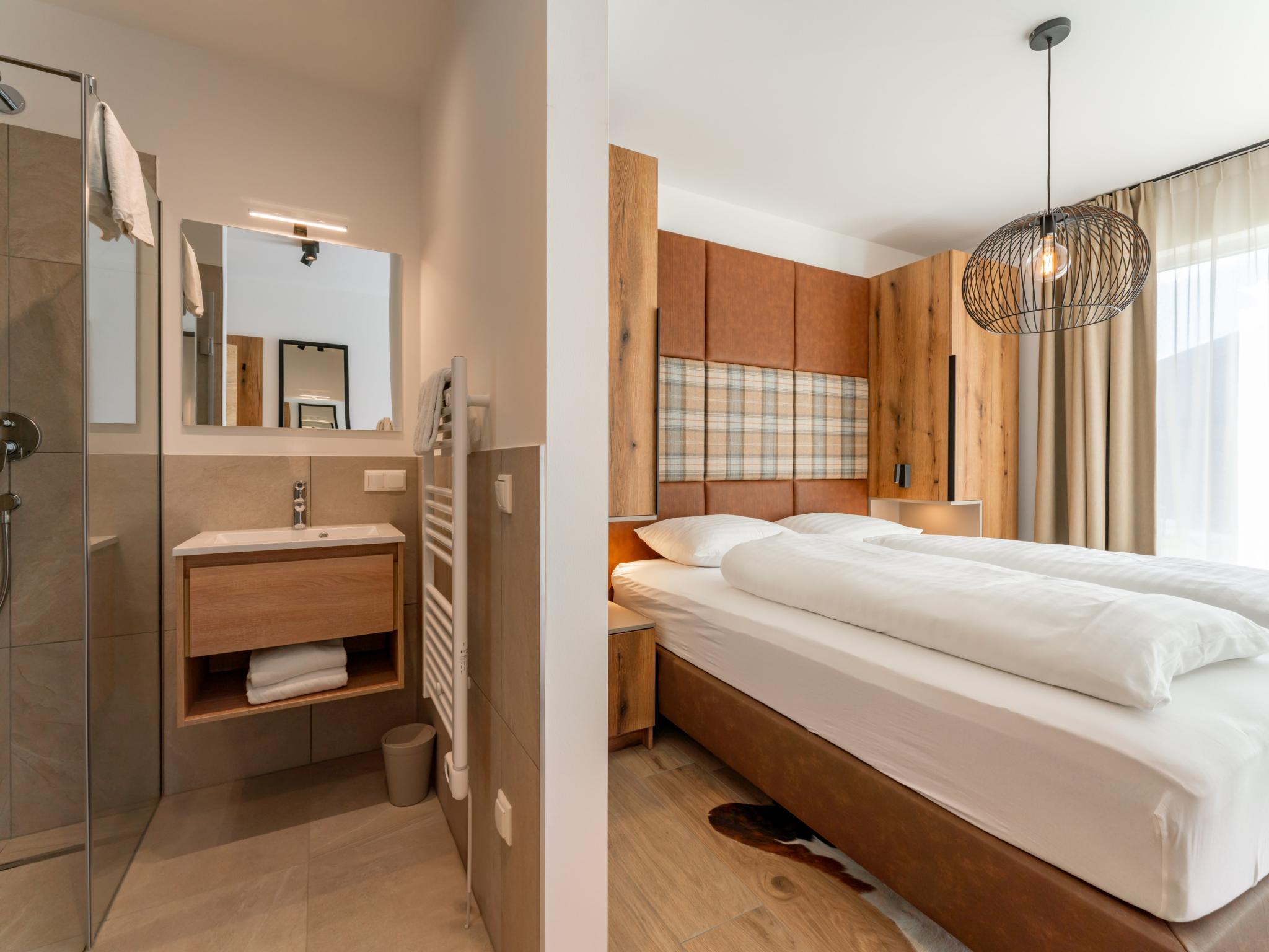 Outdoor terrace and views at Grebenzen Lodge 51 in Sankt Lambrecht