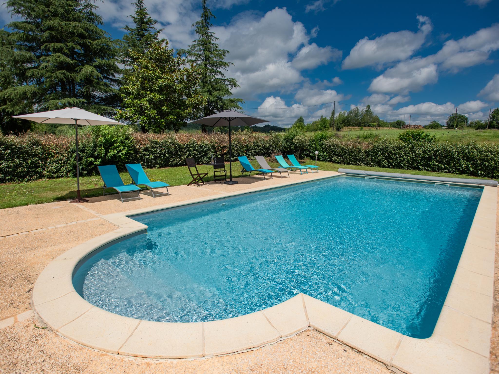 Swimming pool area at L Aiguillou in Besse