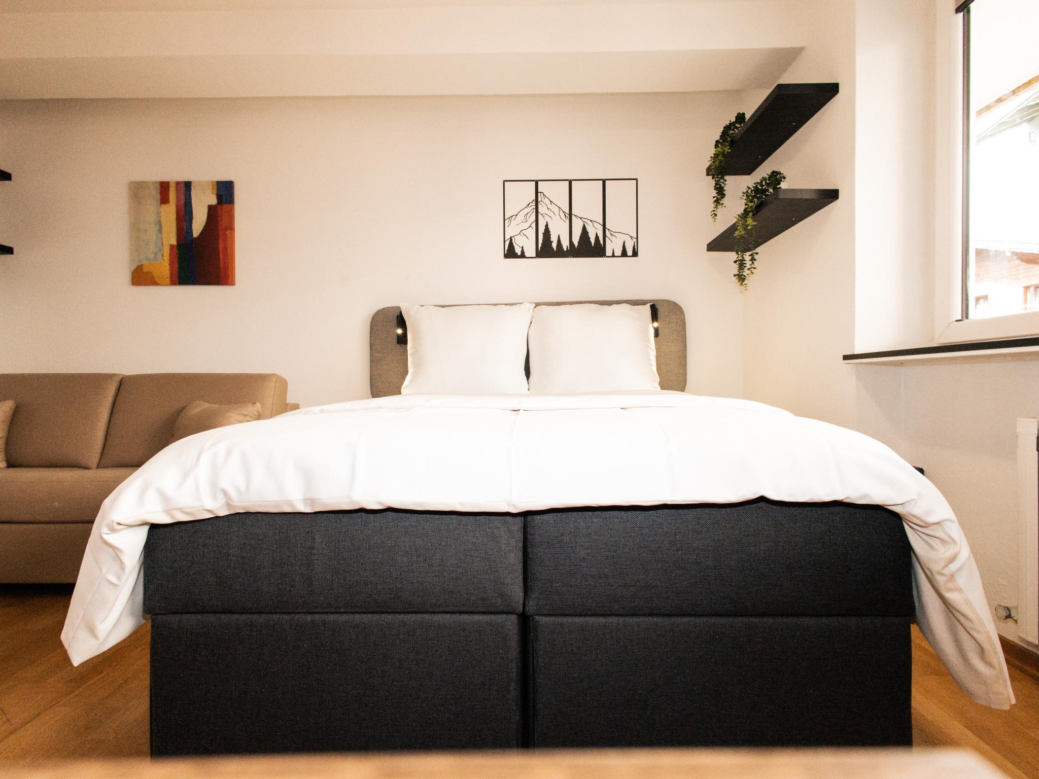 Bedroom with comfortable beds at Prost in Hopfgarten im Brixental