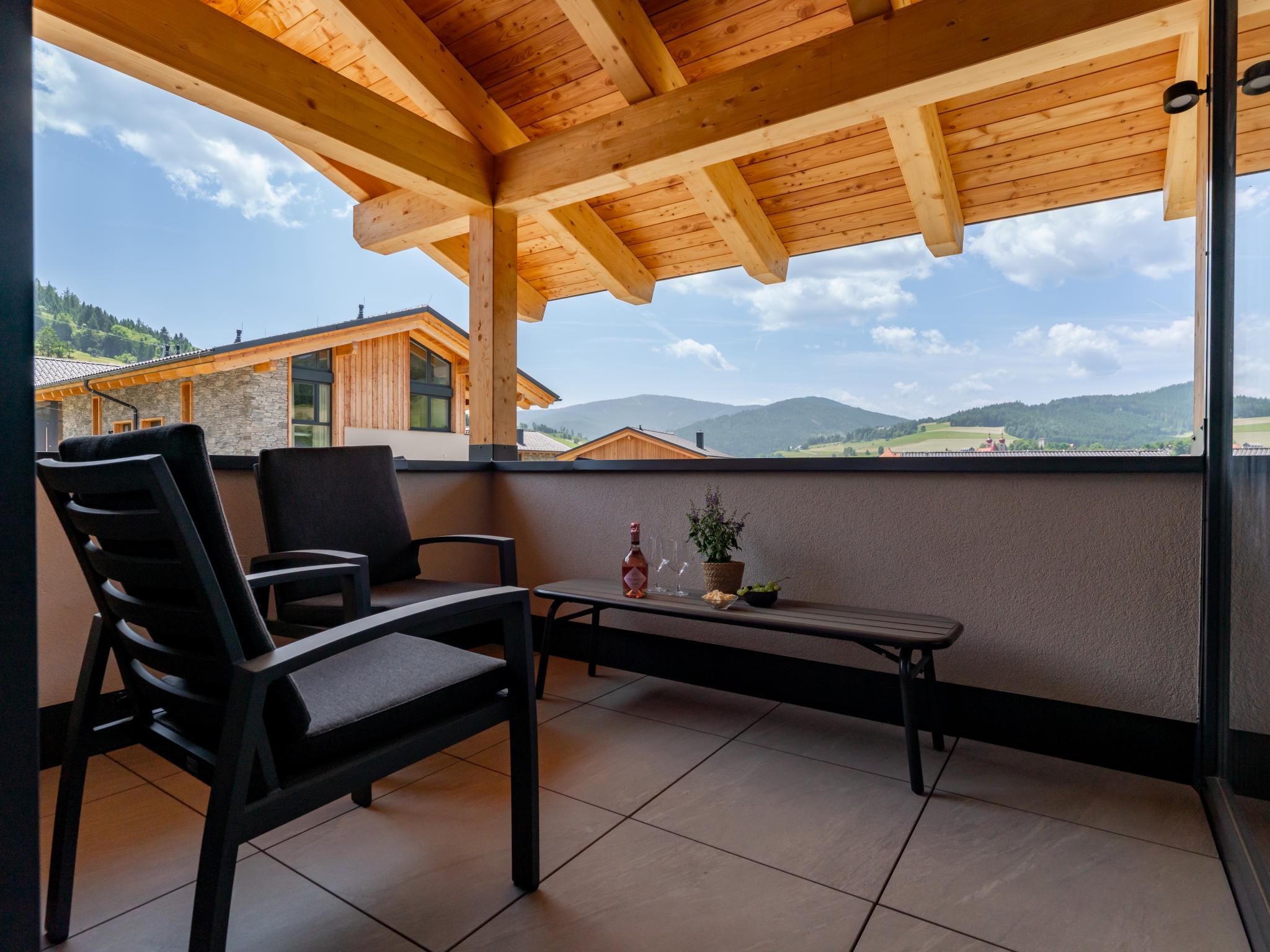 Outdoor terrace and views at Grebenzen Lodges 49B in Sankt Lambrecht