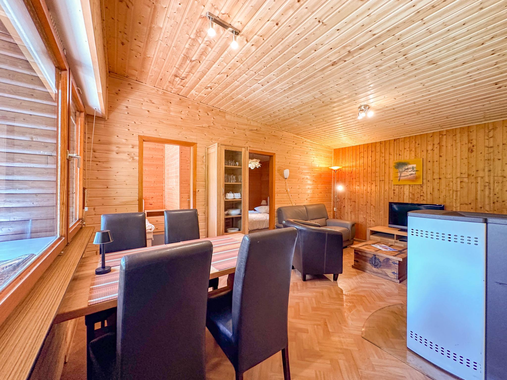 Swimming pool area at Wood Cabin in Brandscheid