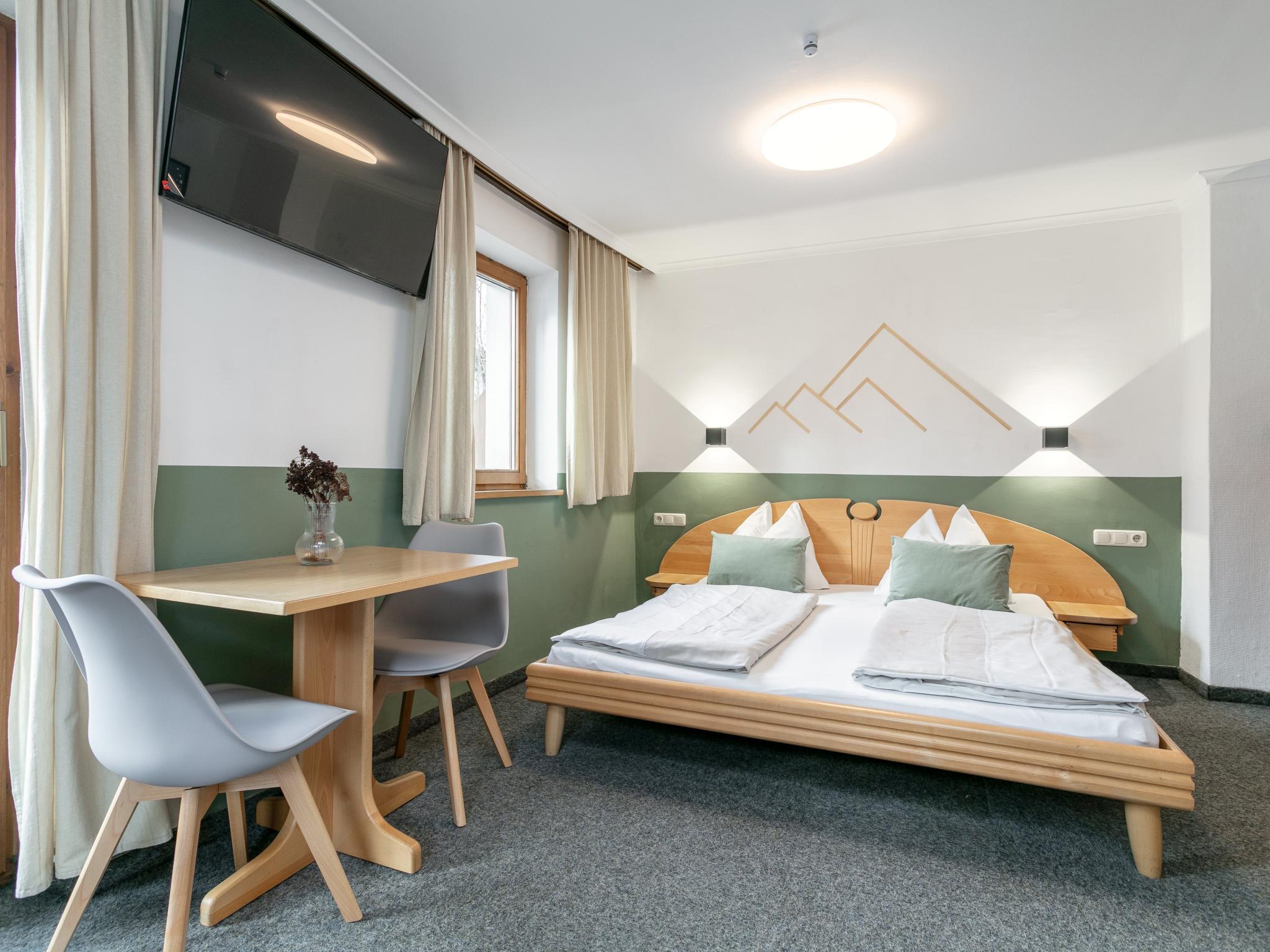 Bedroom with comfortable beds at Pension Schreder XL in Kirchberg in Tirol