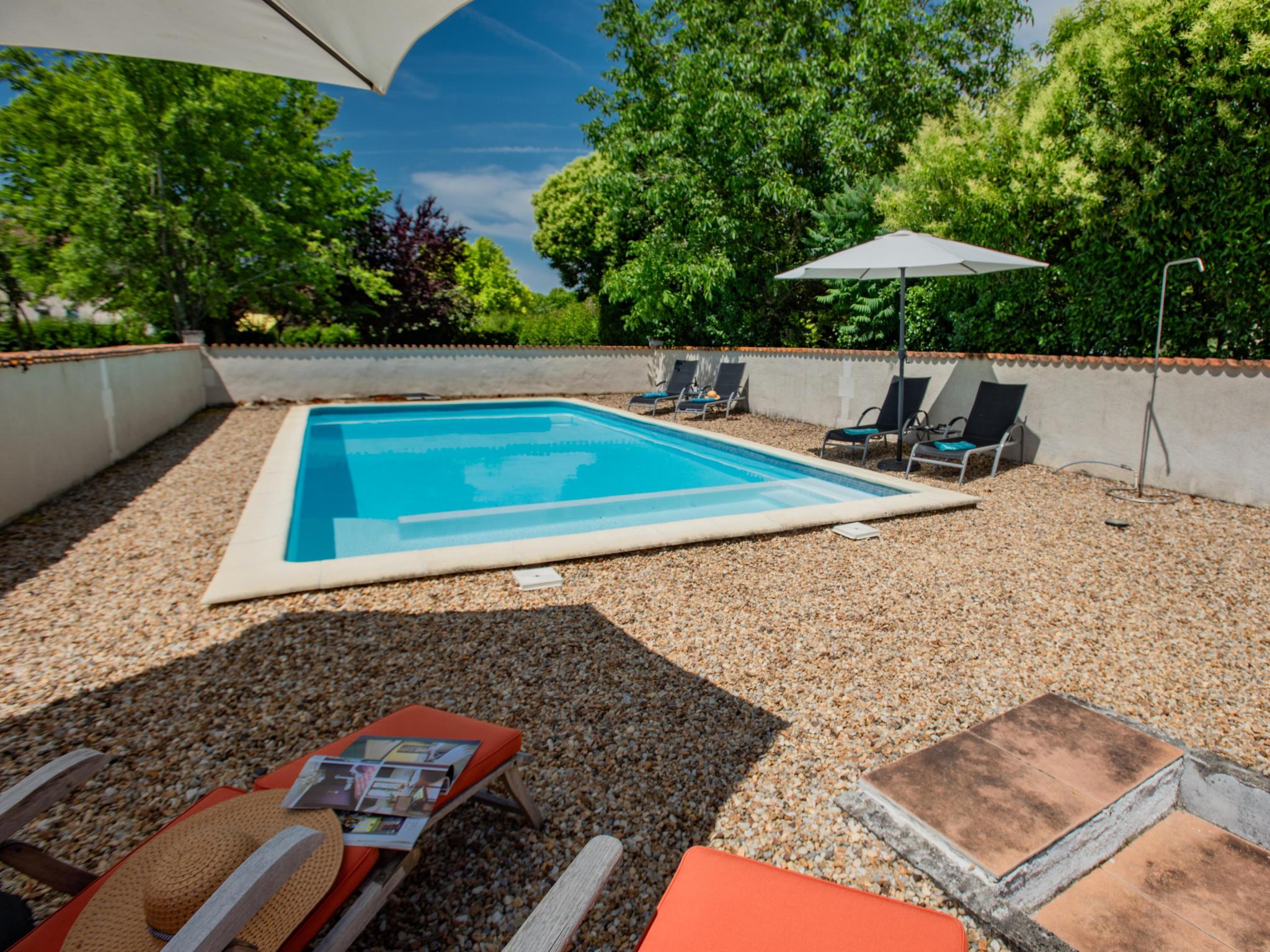 Swimming pool area at Gîtes de La Maison du Bonnesheur in Bonnes