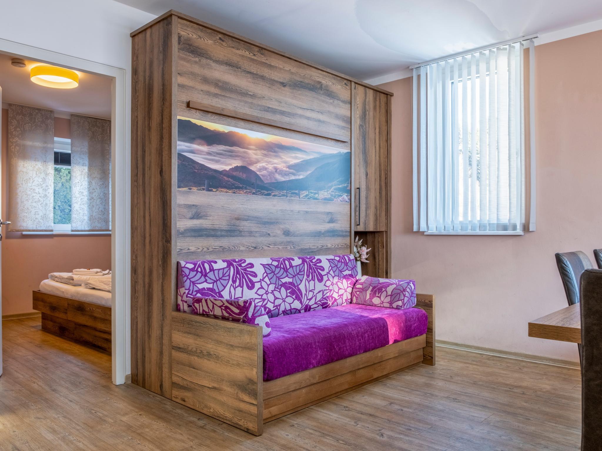 Bedroom with comfortable beds at Sonne in Bruck an der Großglocknerstraße