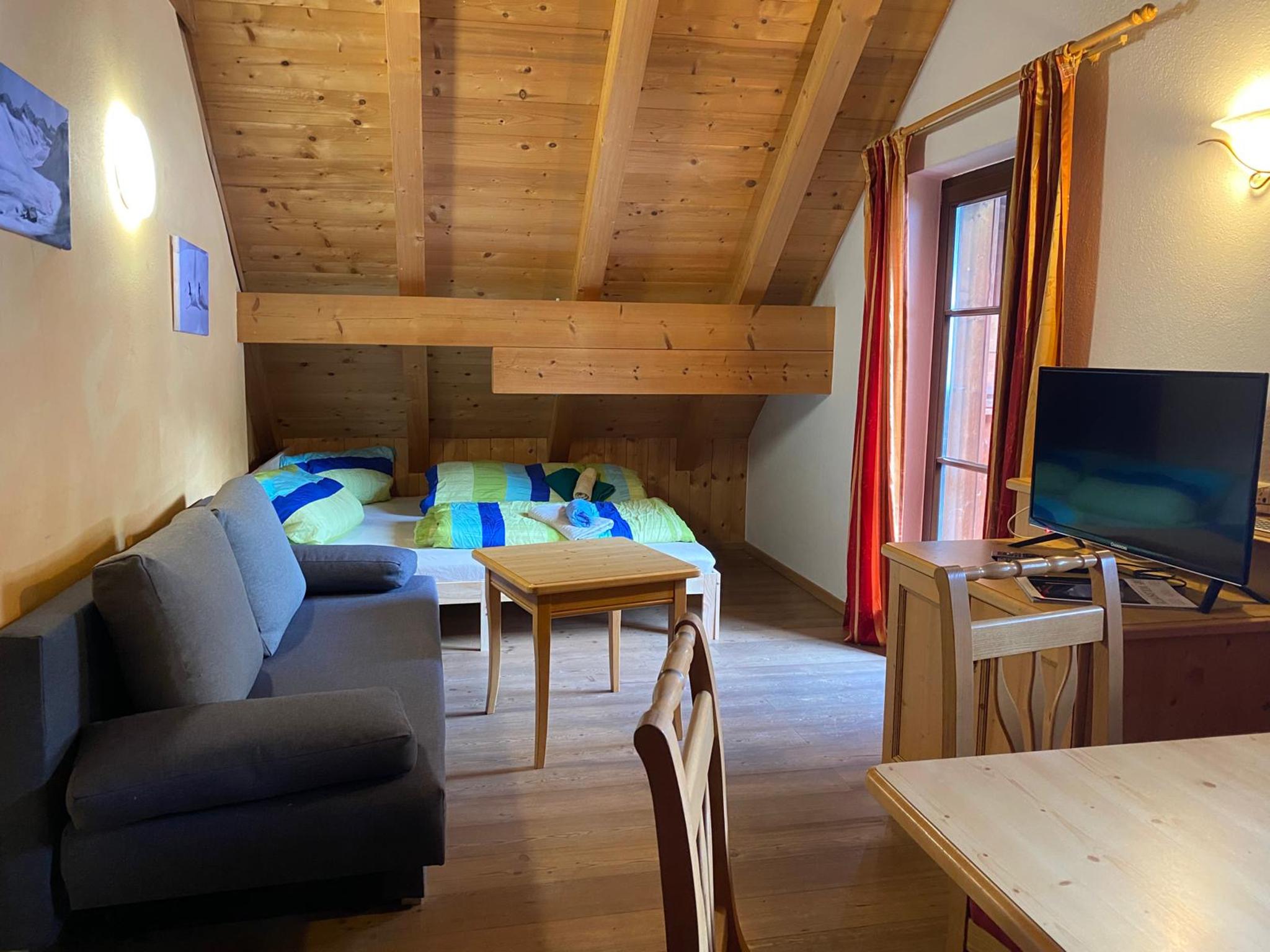 Bedroom with comfortable beds at Schweizerhof Apfelrose in Huben