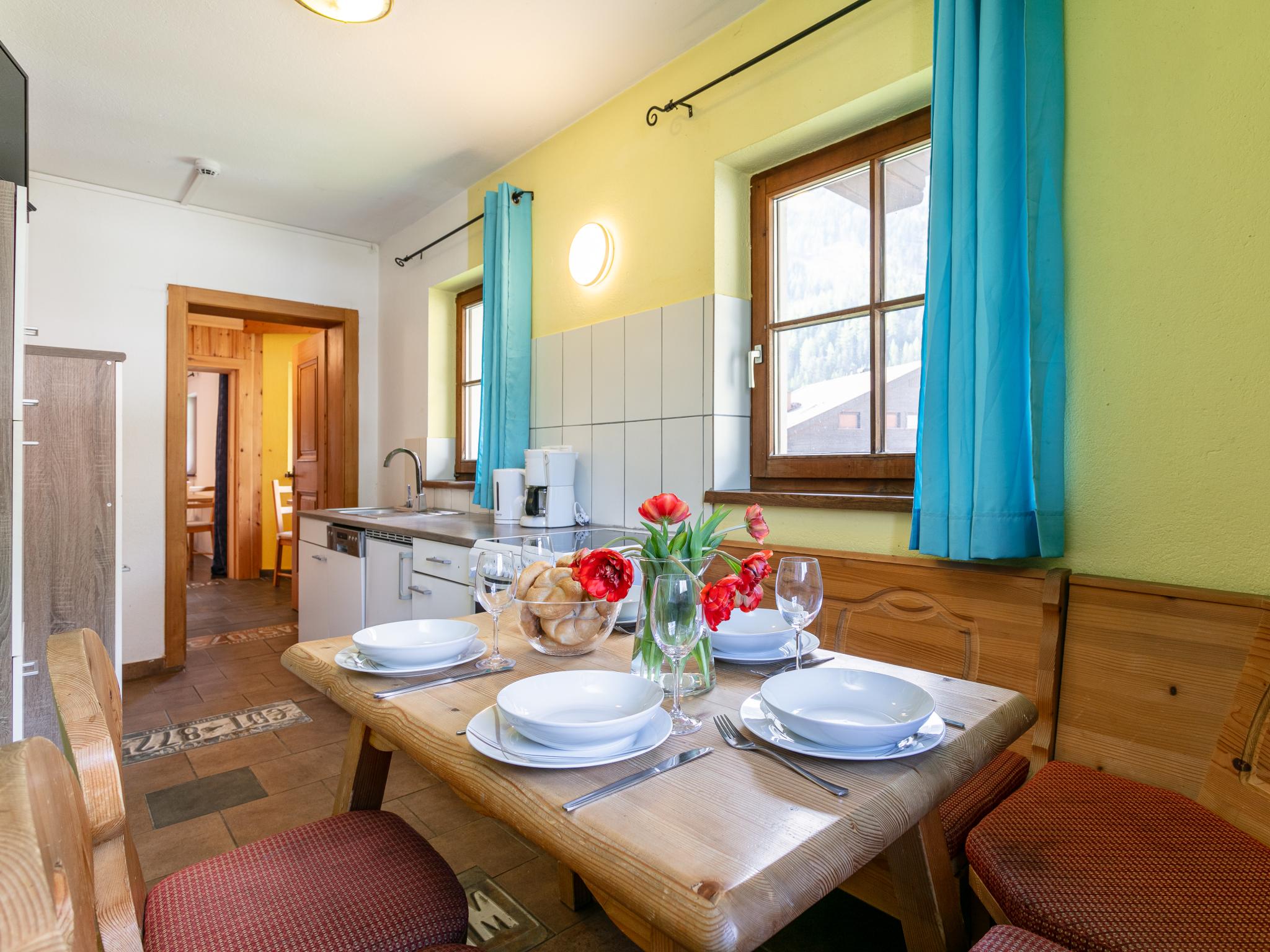 Bedroom with comfortable beds at Schweizerhof Enzian in Huben
