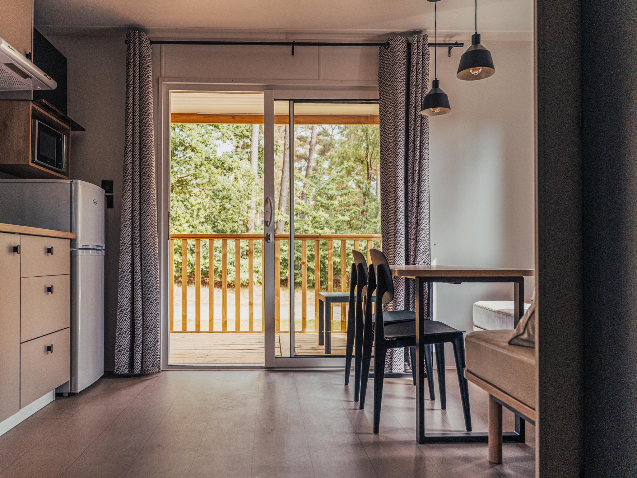 Swimming pool area at Loggia Wood in Vessem