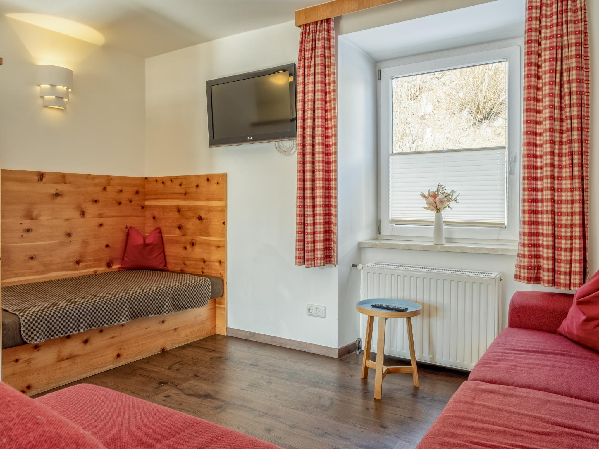 Bedroom with comfortable beds at Bergzeit Fieberbrunn 1 in Fieberbrunn