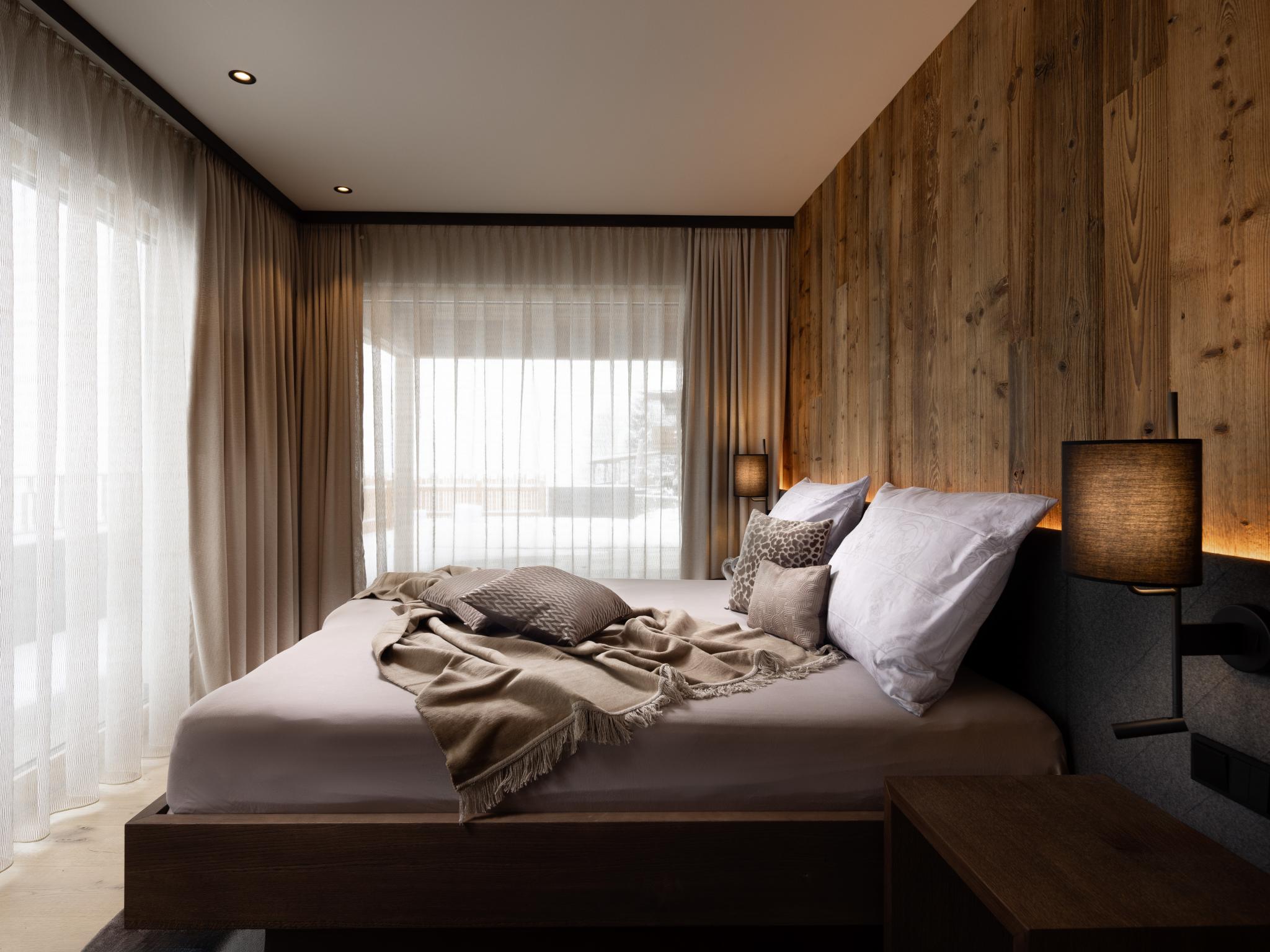 Bedroom with comfortable beds at Das Haus am Berg in Bramberg am Wildkogel