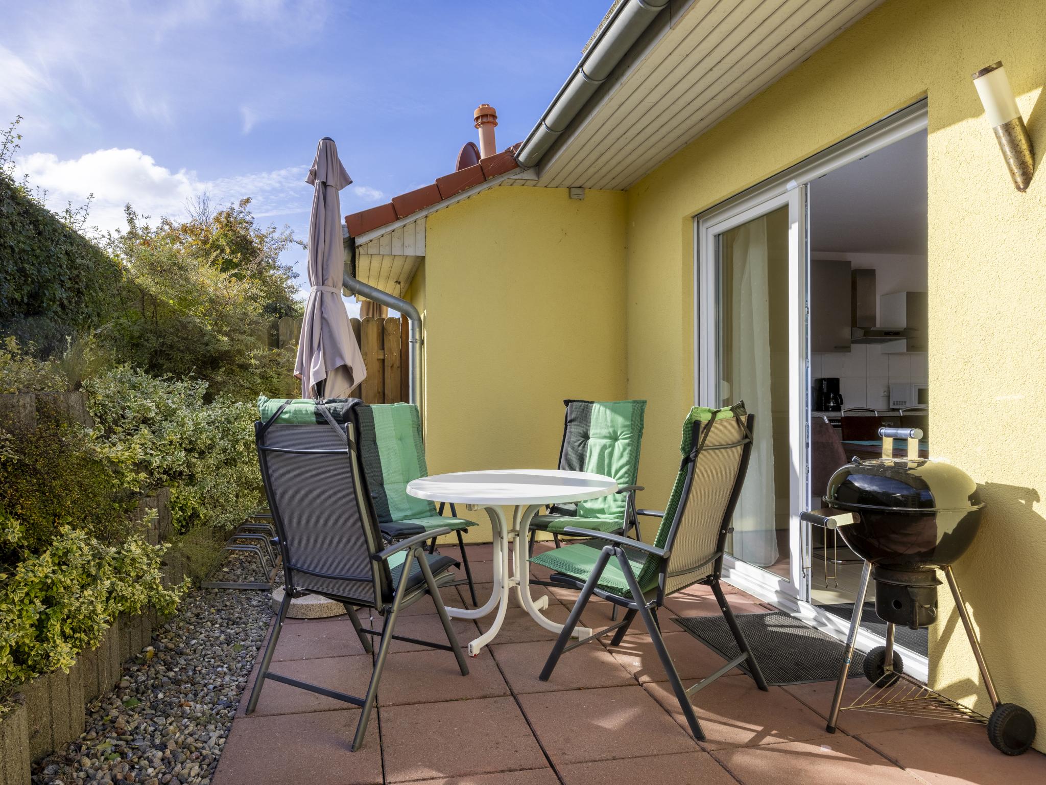 Outdoor terrace and views at Windflüchter links mit Sauna in Boiensdorf