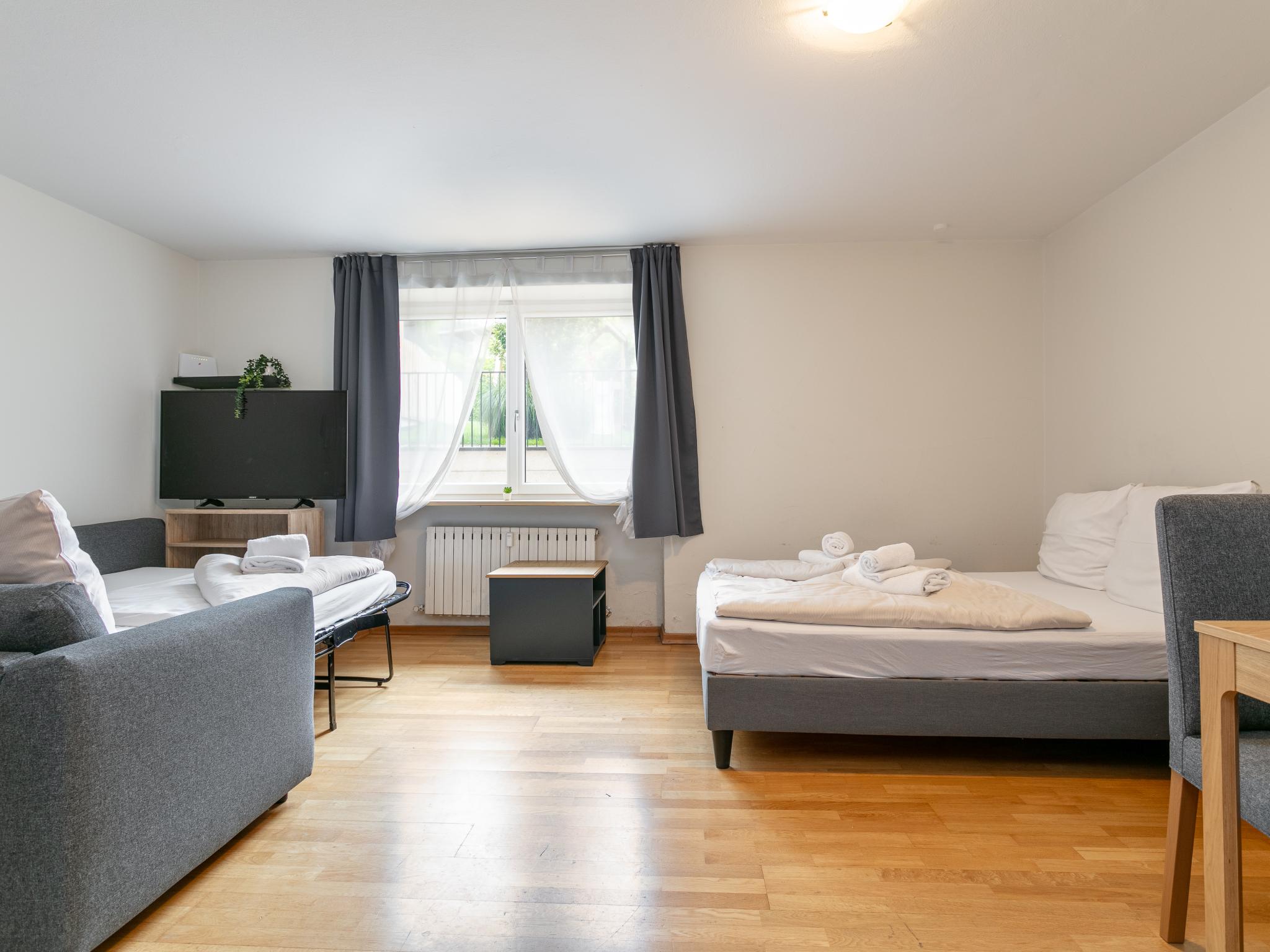 Bedroom with comfortable beds at Town House 2 in Hopfgarten im Brixental