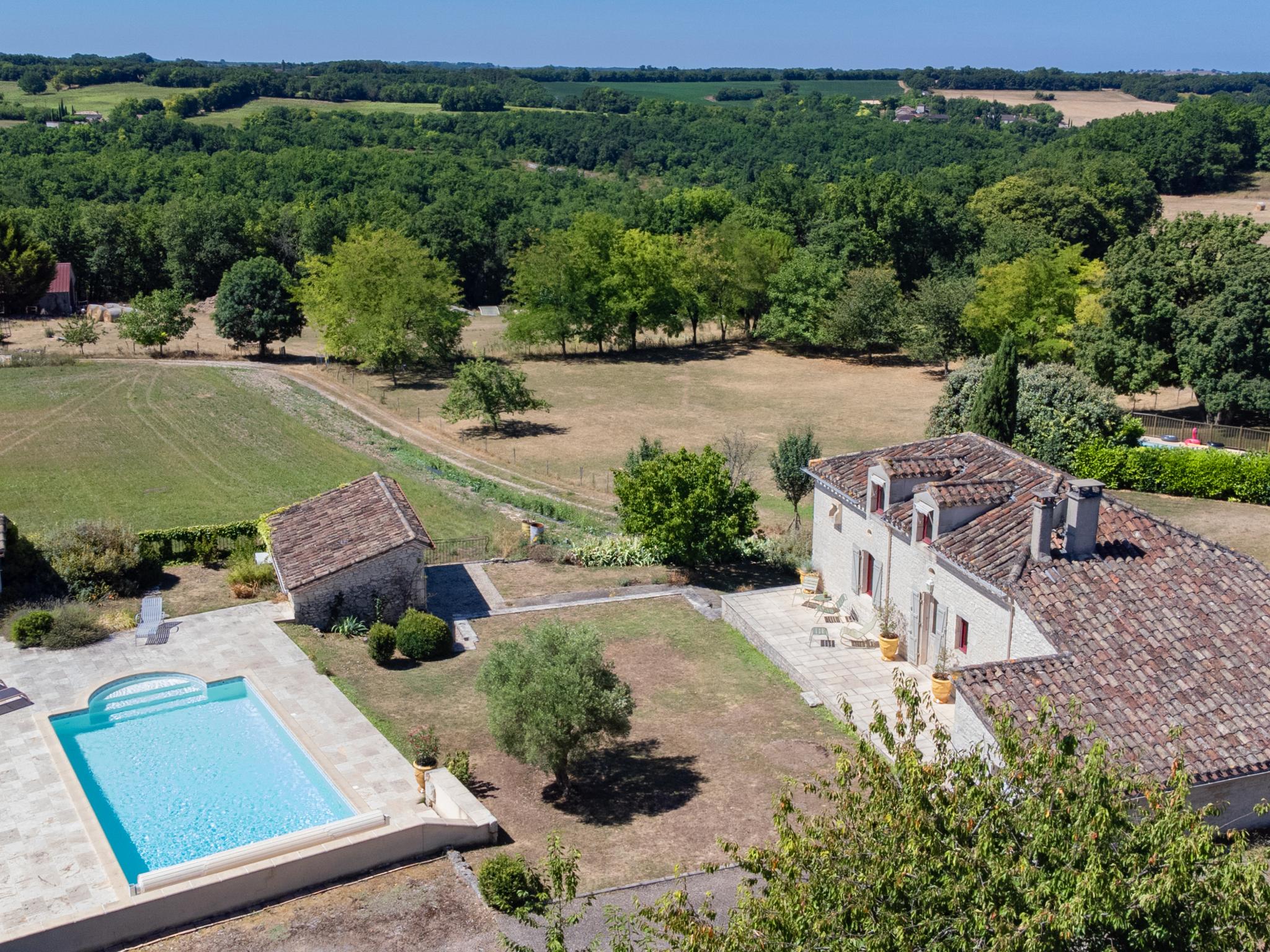 Swimming pool area at Les Artals in Montaigu de Quercy