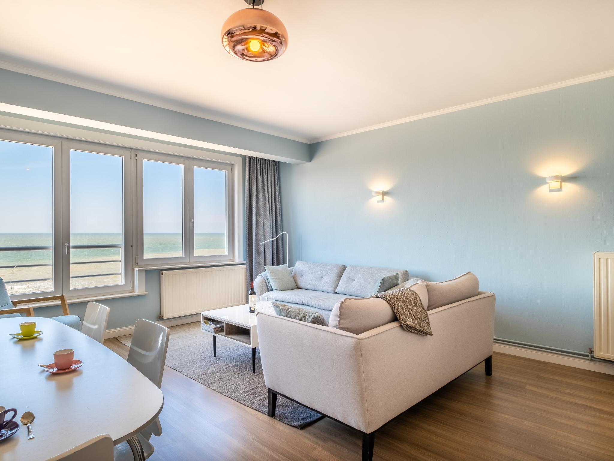 Bedroom with comfortable beds at La Plage cinq in Koksijde