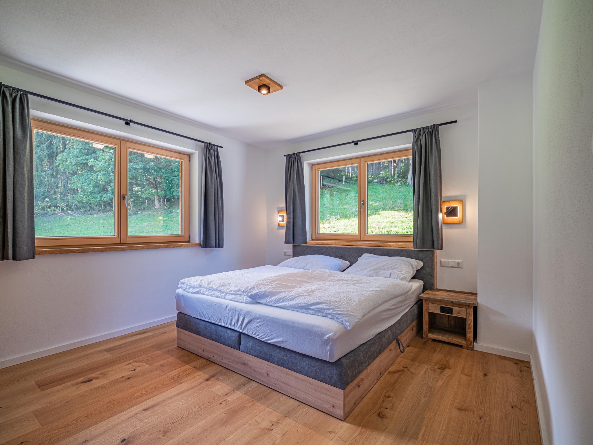 Bedroom with comfortable beds at Haus Bergstille Top 3 in Wald im Pinzgau