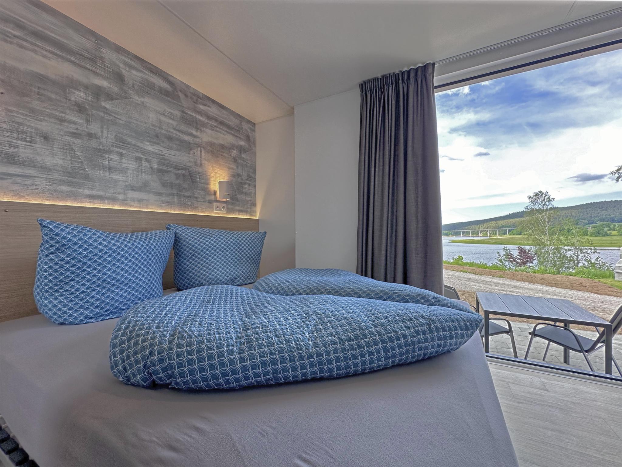 Bedroom with comfortable beds at Feriendorf Seeblick - Tiny Nr 10 in Neunburg vorm Wald