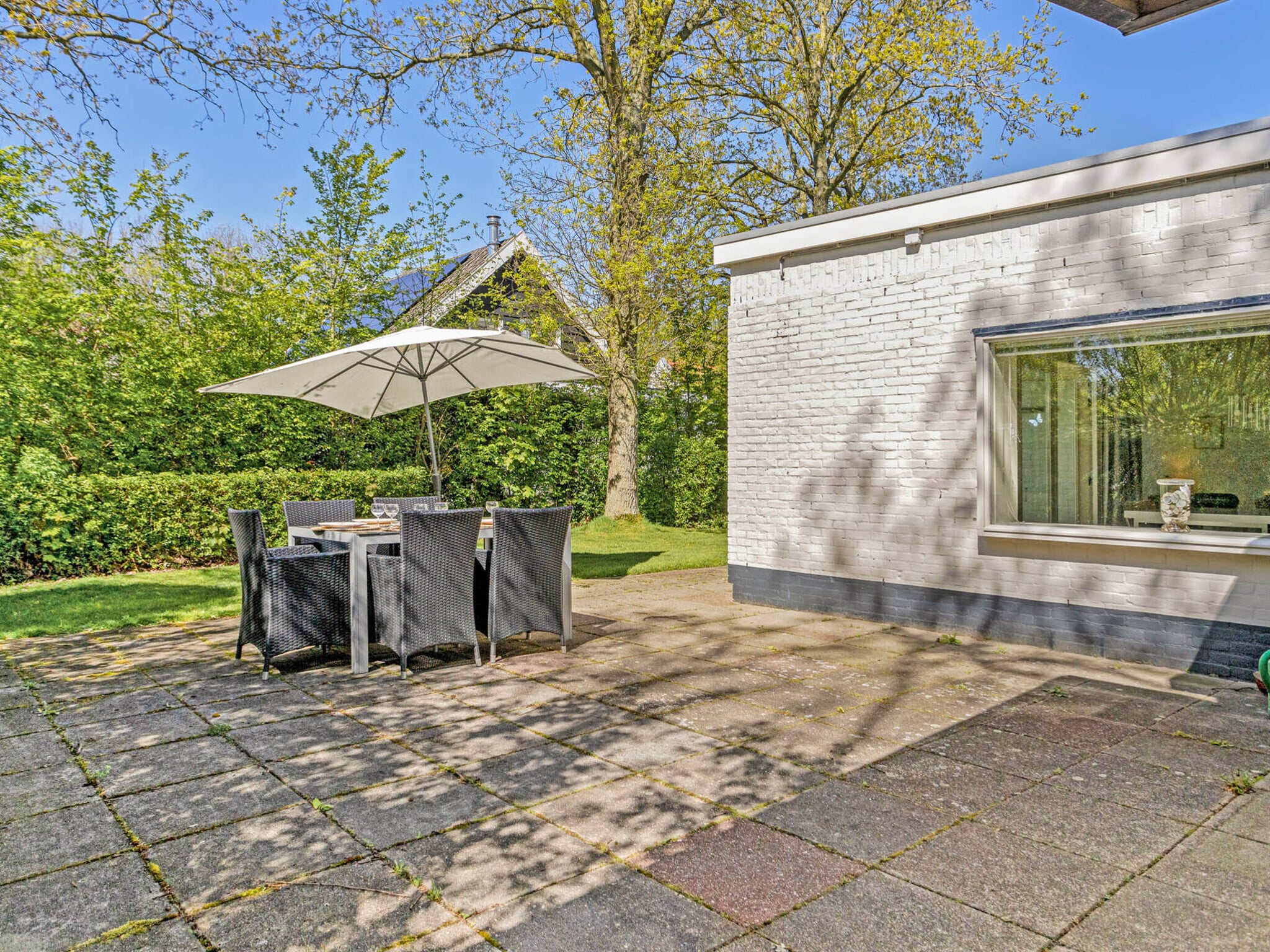 Outdoor terrace and views at Duinlodge Groot Valkenisse in Biggekerke