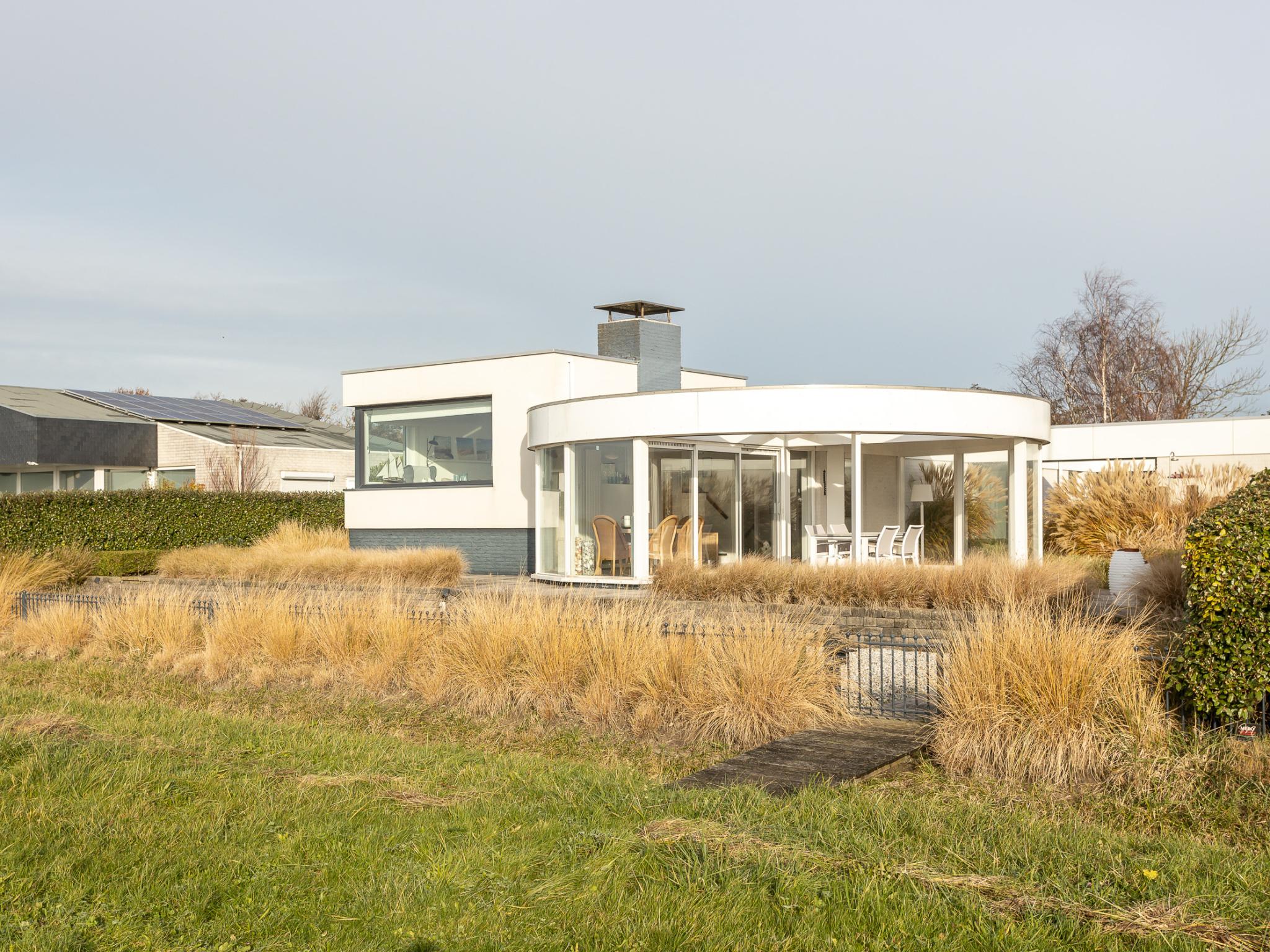 Outdoor terrace and views at Veerse Meer Natuurvilla in Kamperland