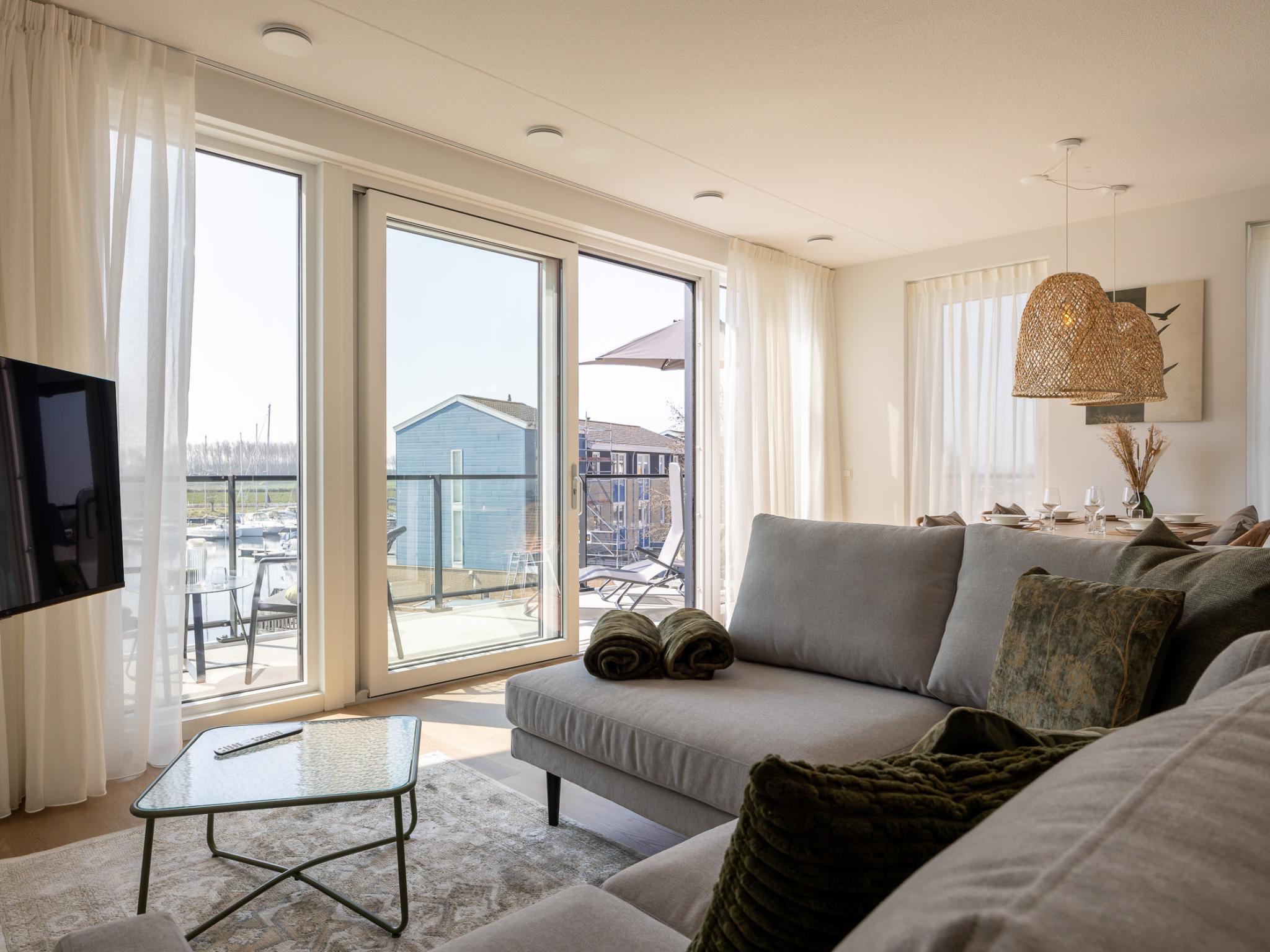 Bedroom with comfortable beds at Panorama Appartement Kortgene in Kortgene