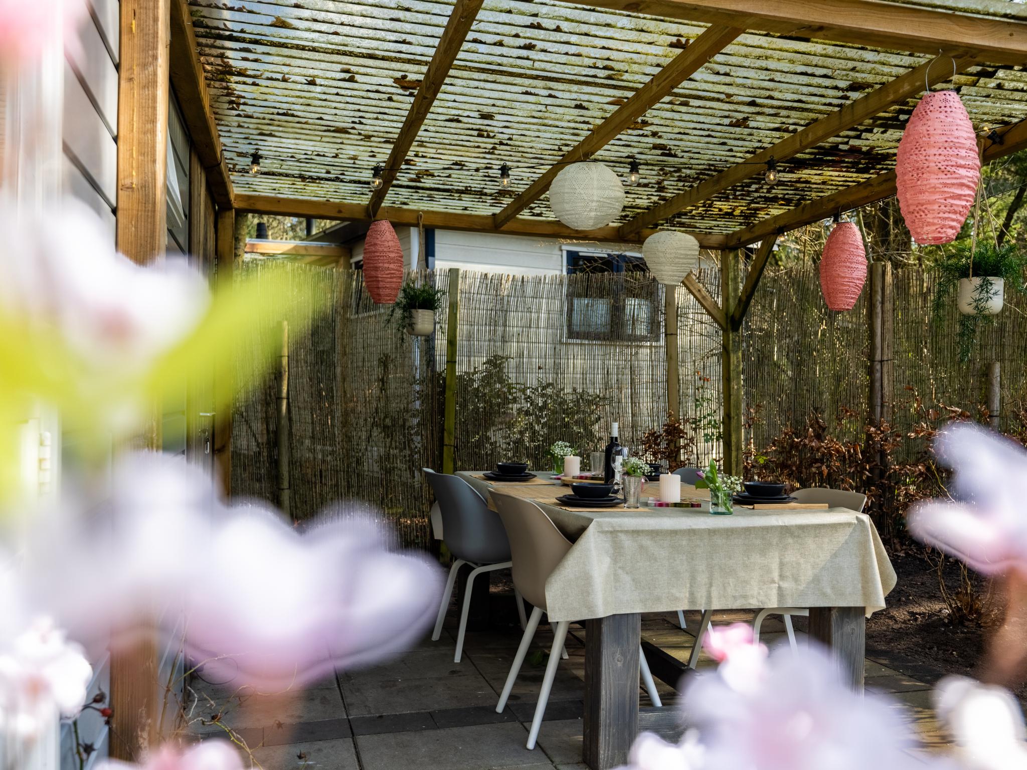 Outdoor terrace and views at Boschalet Stijn in Hattemerbroek