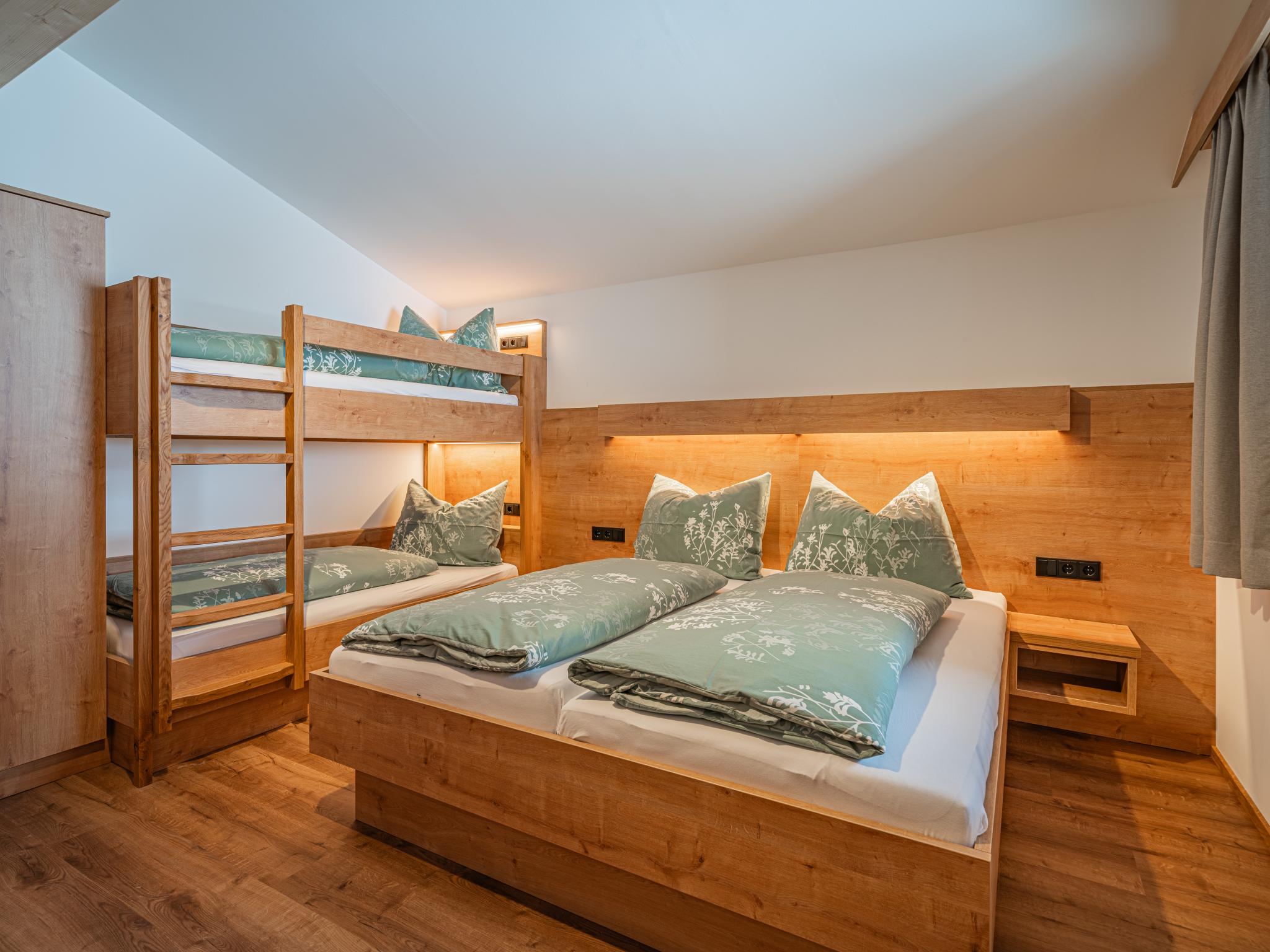Bedroom with comfortable beds at Glückauf in Krimml