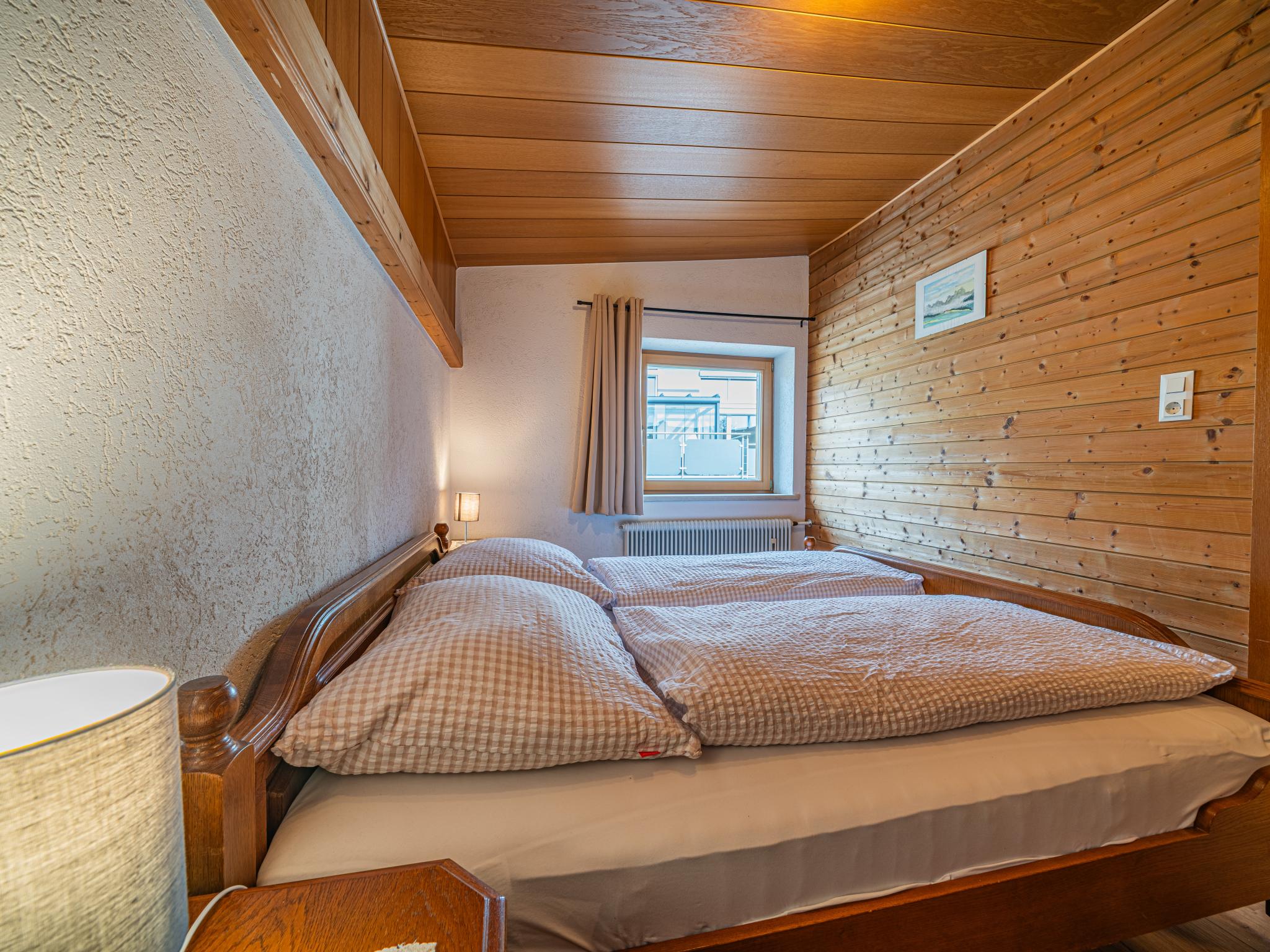Bedroom with comfortable beds at Das Bergnest Dorfglück in Söll