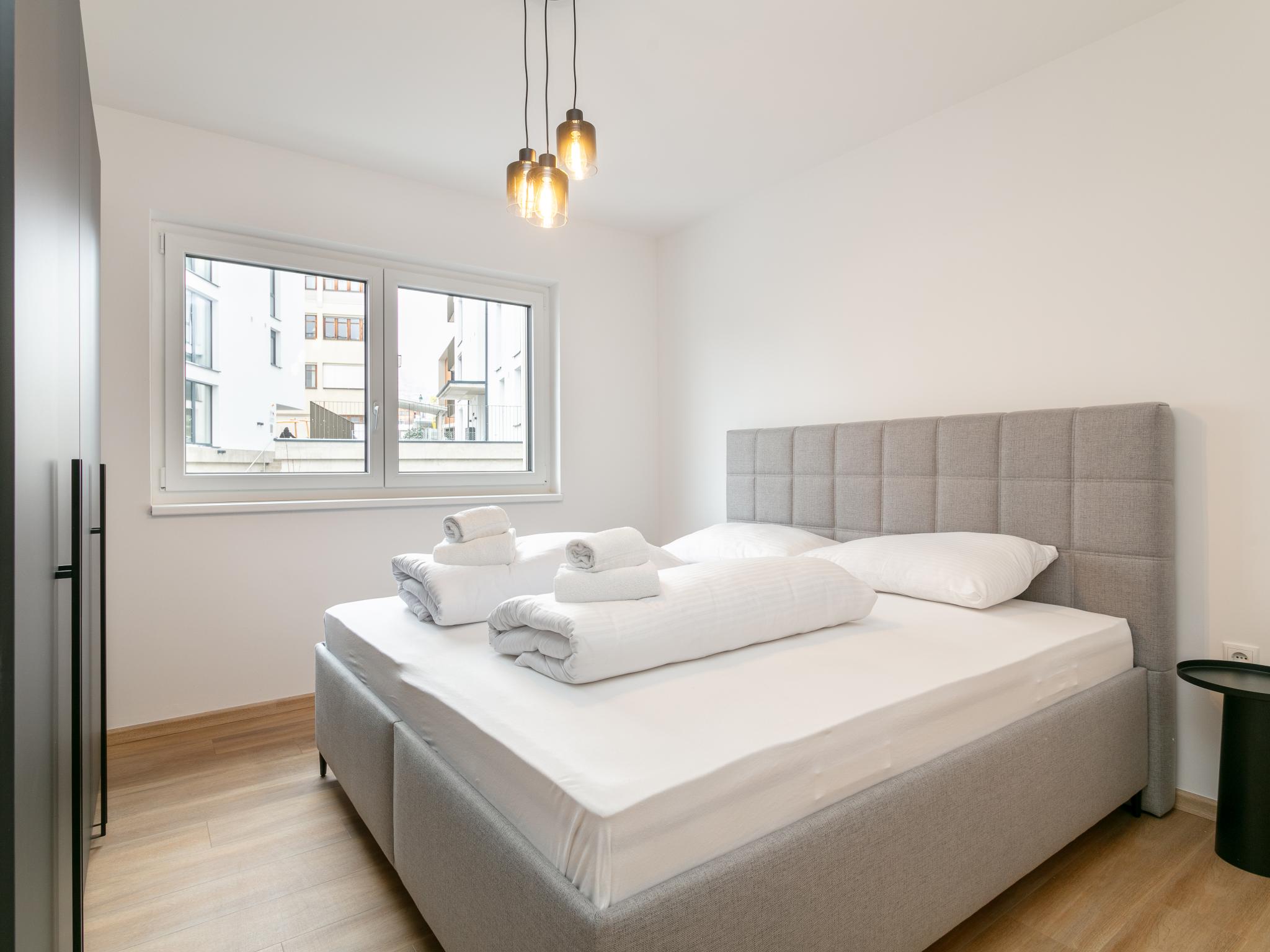 Bedroom with comfortable beds at City Apartments Jenbach Top 2 in Jenbach