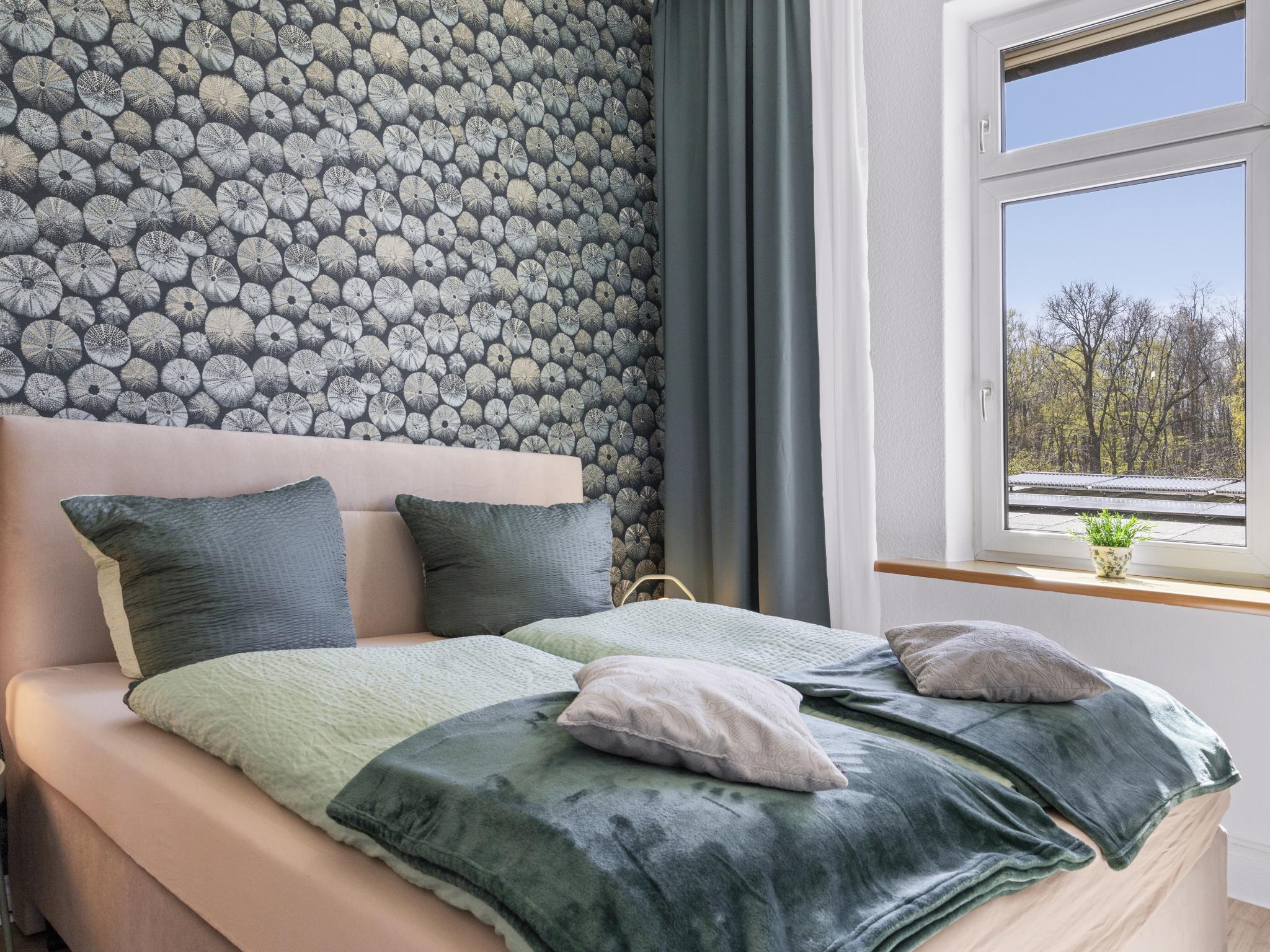 Bedroom with comfortable beds at Villa Erika W7 Marianne mit Strandkorb in Nienhagen